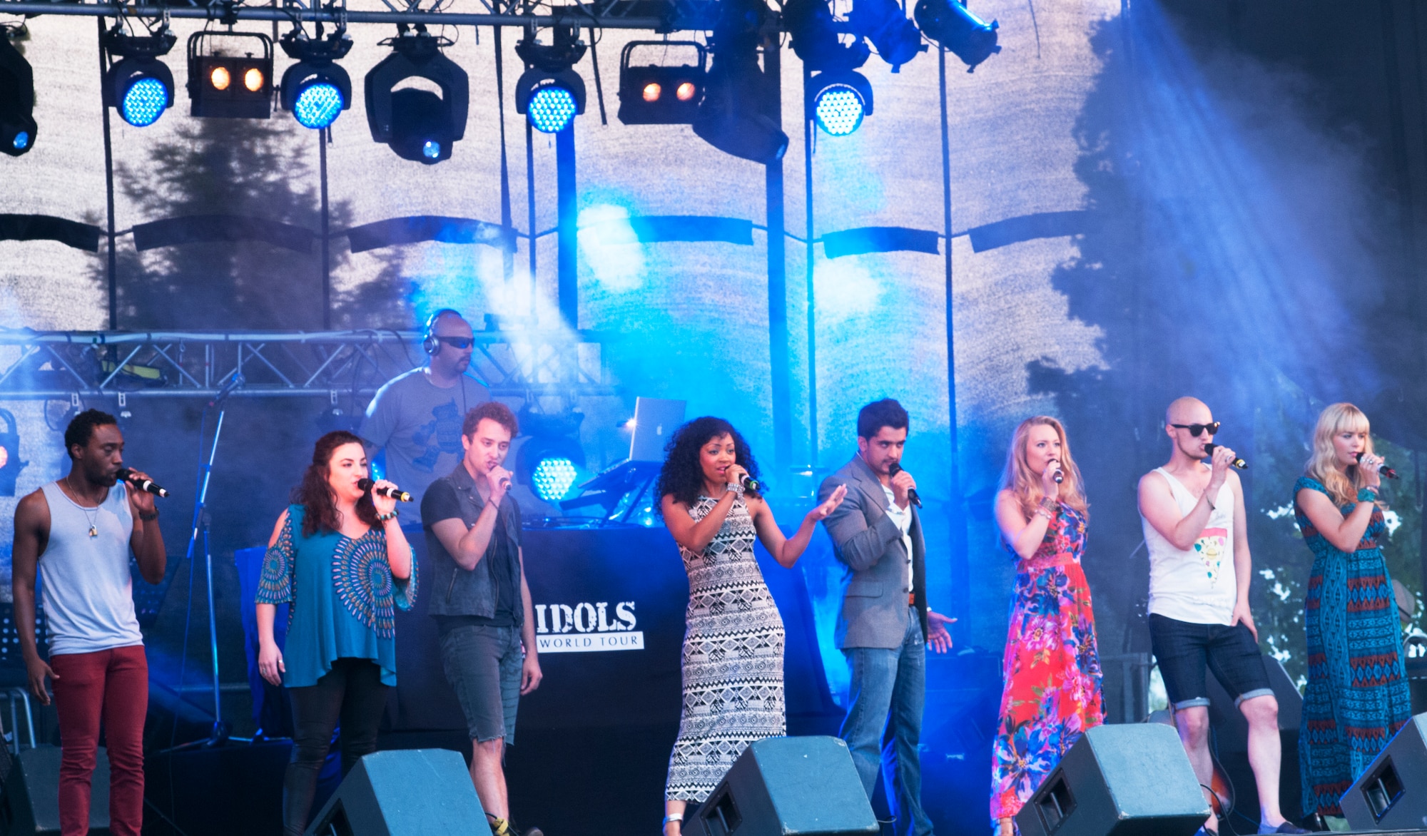 Members of the American Idol Armed Forces tour perform a song together during their concert July 9 at Aviano Air Base, Italy. The former American Idol contestants performed at Aviano as part of a two week tour of Europe and Southwest Asia. (U.S. Air Force photo/Airman 1st Class Briana Jones)                                                               