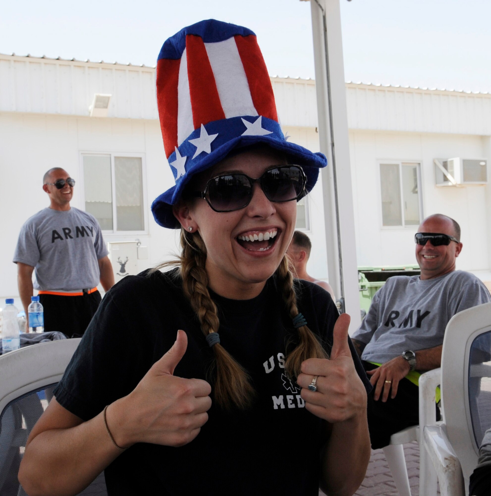 SOUTHWEST ASIA – Staff Sgt. Shila Bonin, 386th Expeditionary Medical Support, shows her patriotic side at the Freedom Fest 2012 here July 4. Although she did not participate in the event, she shows here support at the watermelon eating contest.  (U.S. Air Force photo/Staff Sgt. Alexandra M. Boutte)