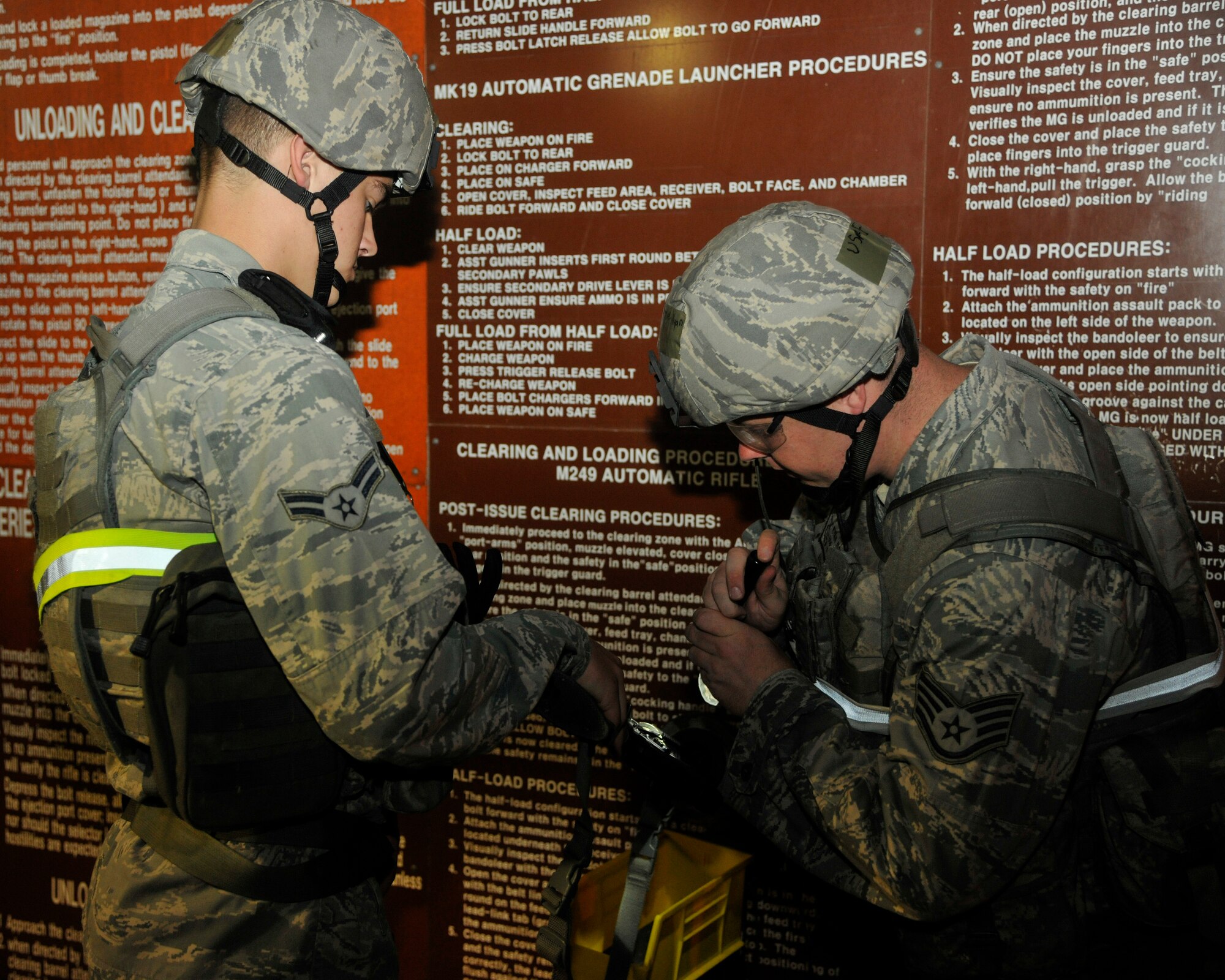 Airmen from the 8th Security Forces Squadron perform a weapons safety check during an exercise at Kunsan Air Base, Republic of Korea, July 8, 2012. The safety of Airmen during the exercise is paramount in ensuring operations run without incident. (US Air Force photo/Senior Airman Marcus Morris)