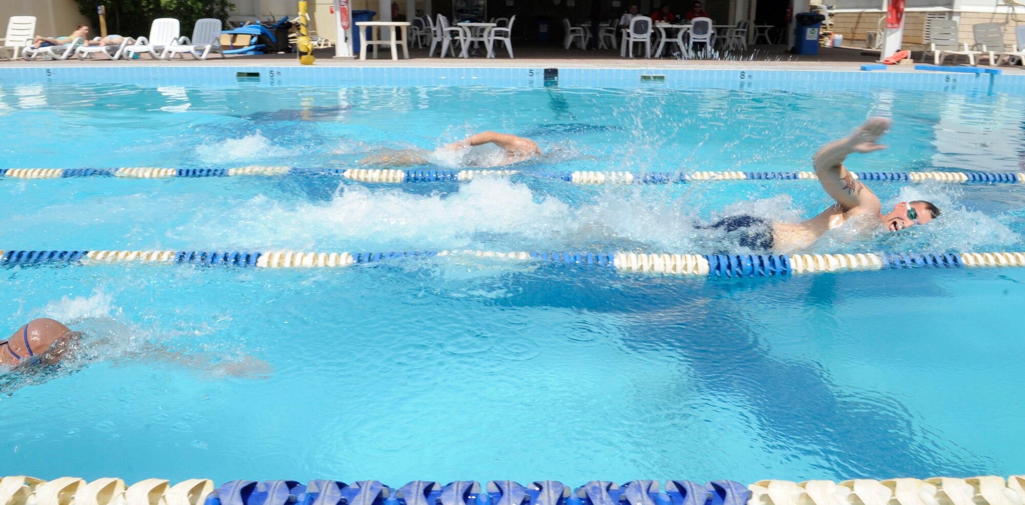 SOUTHWEST ASIA – Members of the 386th Air Expeditionary Wing participate in a 500-meter swim relay during the Freedom Fest 2012 here July 4. The 386th Civil Engineer Squadron fire department won the relay. (U.S. Air Force photo/Staff Sgt. Alexandra M. Boutte)