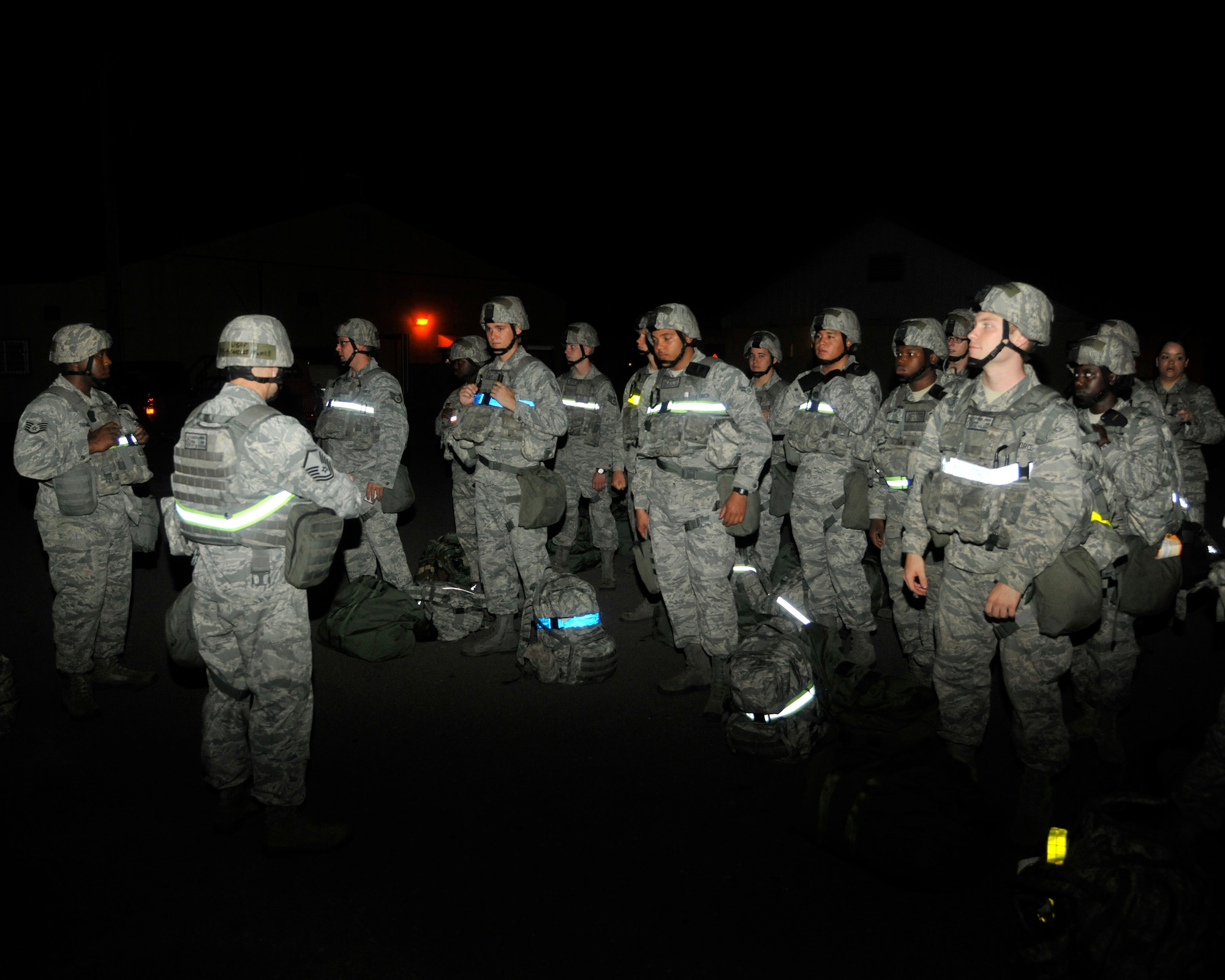 Airmen from the 8th Security Forces Squadron take accountability for their personnel at Kunsan Air Base, Republic of Korea, July 8, 2012. With the help of augmentees, Wolf Pack defenders respond to both real-world and exercise related security requirements.  (US Air Force photo/Senior Airman Marcus Morris)