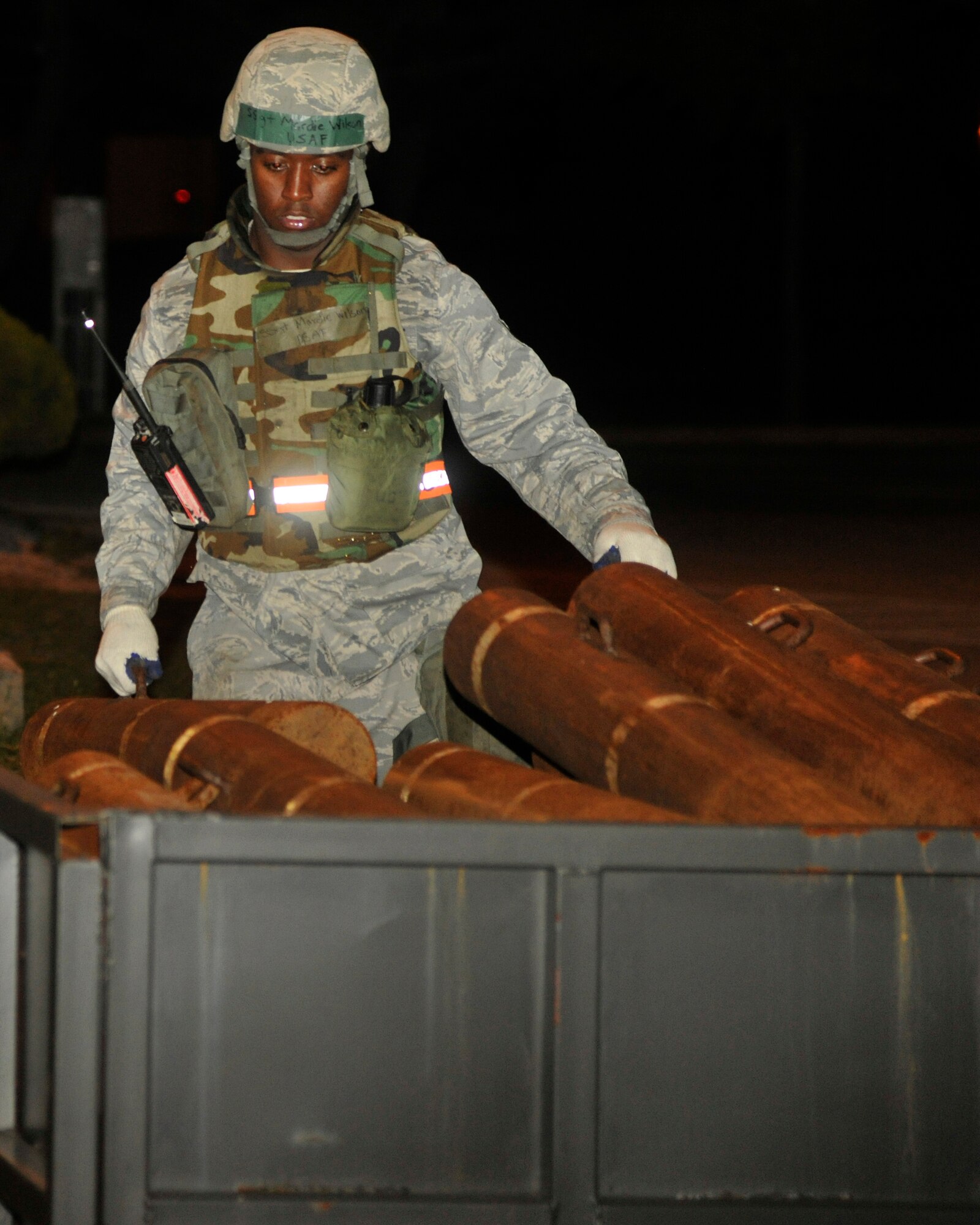 Staff Sgt. Mardie Wilson, 8th Civil Engineer Squadron heavy equipment and pavement operator, transports blockades at Kunsan Air Base, Republic of Korea, July 8, 2012. The barricades limit traffic on base during the exercise. (US Air Force photo/Senior Airman Marcus Morris)