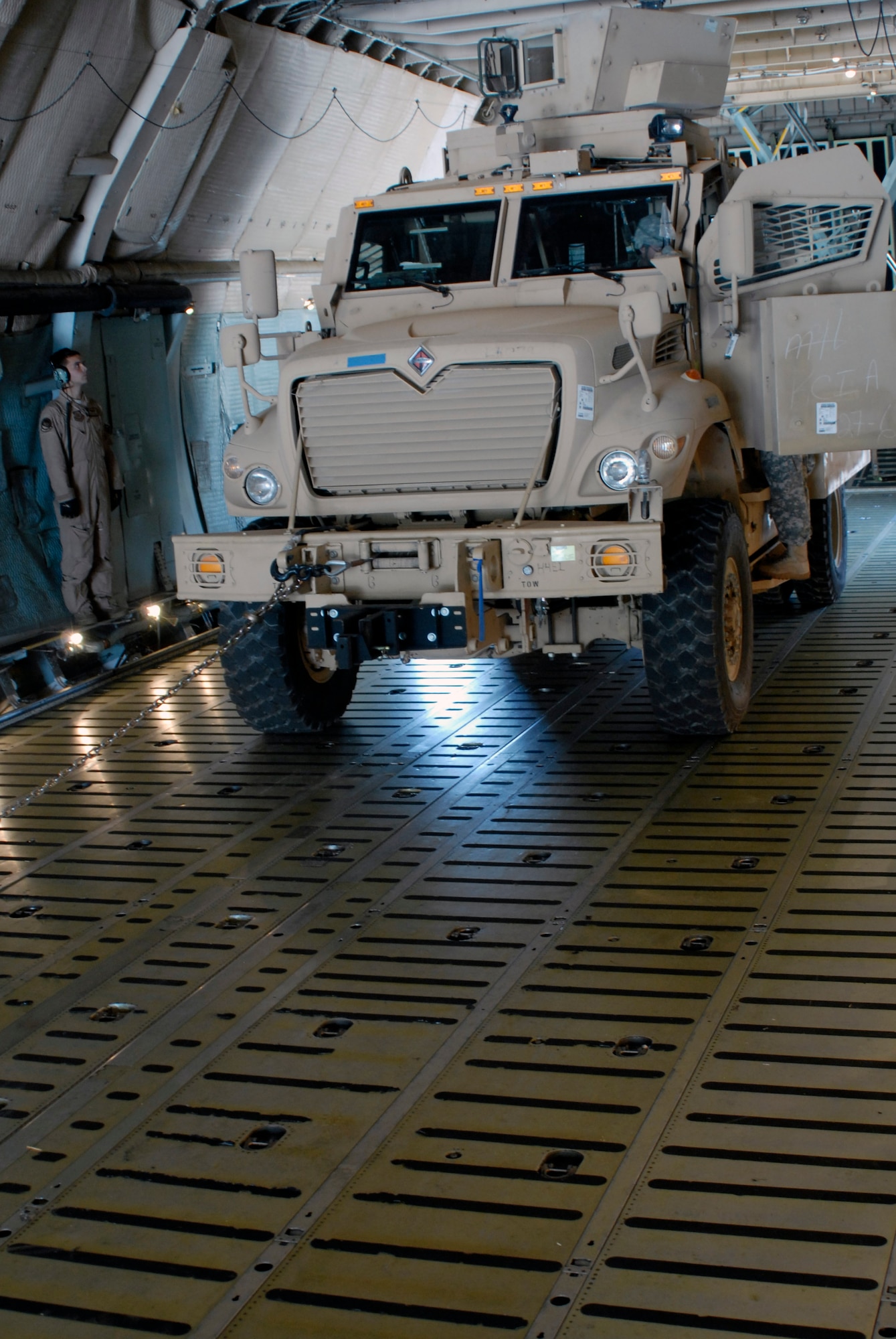 Staff Sgt. Carl Murphy, Division Master Driver for the 2nd Infantry Division, prepares to drive a Mine Resistant Ambush Protected vehicle off of a C-5 Galaxy at Osan Air Base, Republic of Korea, July 7, 2012. This was the second shipment of MRAP vehicles delivered to the penninsula for the U.S. Army. The C-5 and its crew are stationed with the 22nd Airlift Squadron delivered from Travis Air Force Base, Calif.  (U.S. Air Force photo/Tech. Sgt. Eric Petosky)