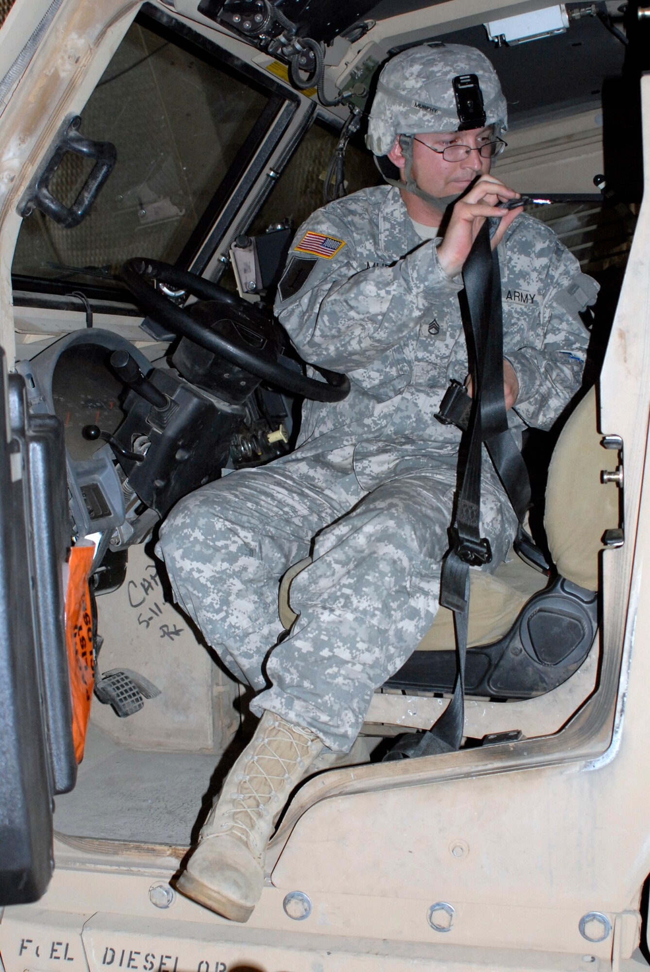 Staff Sgt. Carl Murphy, Division Master Driver for the 2nd Infantry Division, straps into a Mine Resistant Ambush Protected vehicle July 7, 2012. A C-5 Galaxy of the 22nd Airlift Squadron delivered the MRAP vehicles to Osan Air Base, Republic of Korea, from Travis Air Force Base, Calif. The MRAPs provide an additional capability for U.S. Army soldiers stationed in Korea. (U.S. Air Force photo/Tech. Sgt. Eric Petosky)