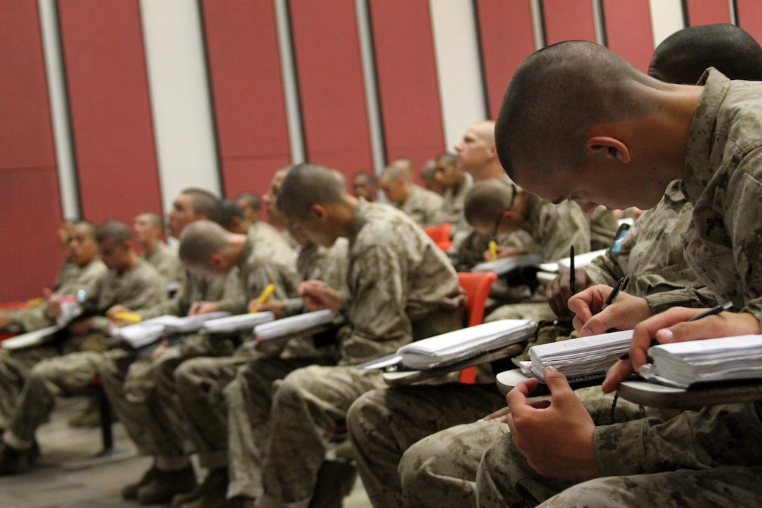 Recruits with Platoon 3202, India Company, 3rd Recruit Training Battalion, listen intently to a class on Marine history aboard Marine Corps Recruit Depot San Diego, July 6. Co. I drill instructors advised recruits to use any spare time to study their notes because they will be tested on the material on training day 55.