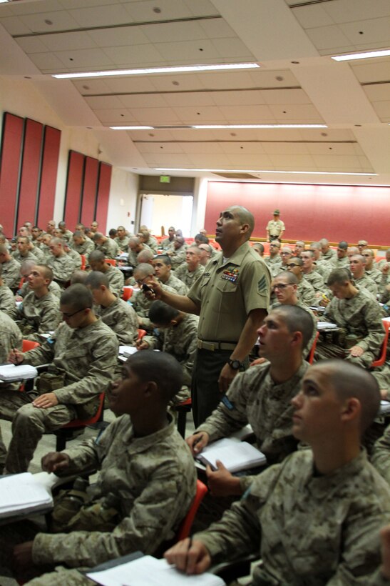 Recruits with Platoon 3202, India Company, 3rd Recruit Training Battalion, listen intently to a class on Marine history aboard Marine Corps Recruit Depot San Diego, July 6. Co. I drill instructors advised recruits to use any spare time to study their notes because they will be tested on the material on training day 55.
