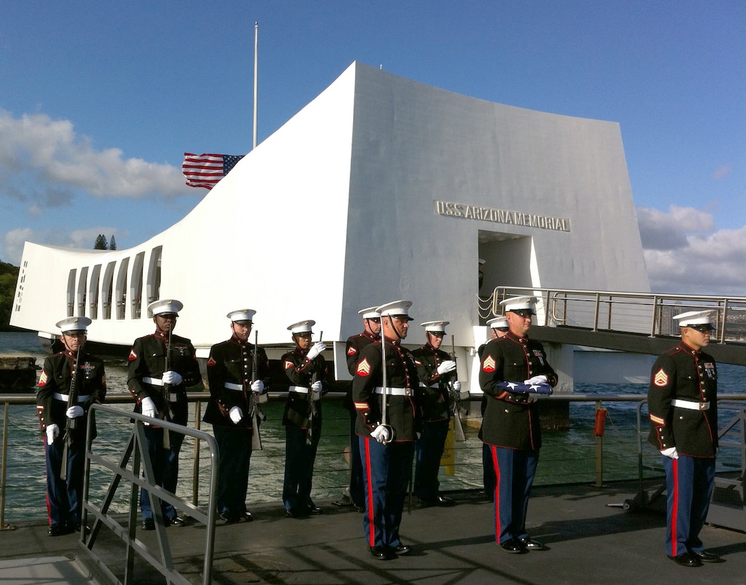 A Marine rifle honor guard from 3rd Marine Regiment prepares to greet the family of Pfc. Frank Cabiness as they carry his urn aboard the USS Arizona Memorial Dec. 23. Cabiness is the second Marine survivor to be buried with his shipmates.