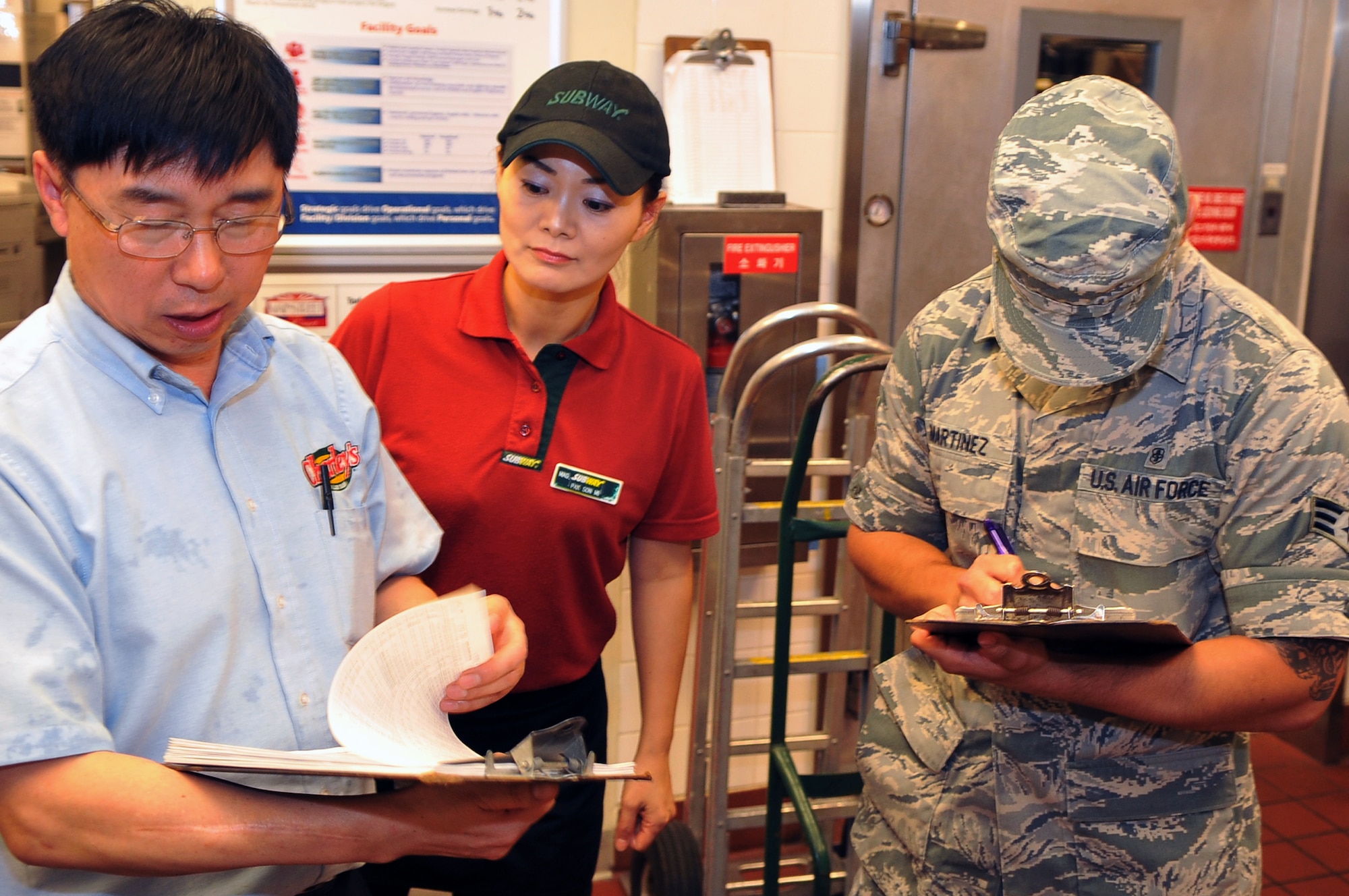 Senior Airman Rene Martinez, 51st Aerospace Medicine Squadron Public Health food inspector, oversees the self-inspection report for Subway at Osan Air Base, Republic of Korea, July 11, 2012. Martinez conducts inspections at commercial and military dining establishments. The self-inspection is a daily requirement for vendors but must be documented once a week by vendors. (U.S. Air Force photo/Staff Sgt. Craig Cisek)