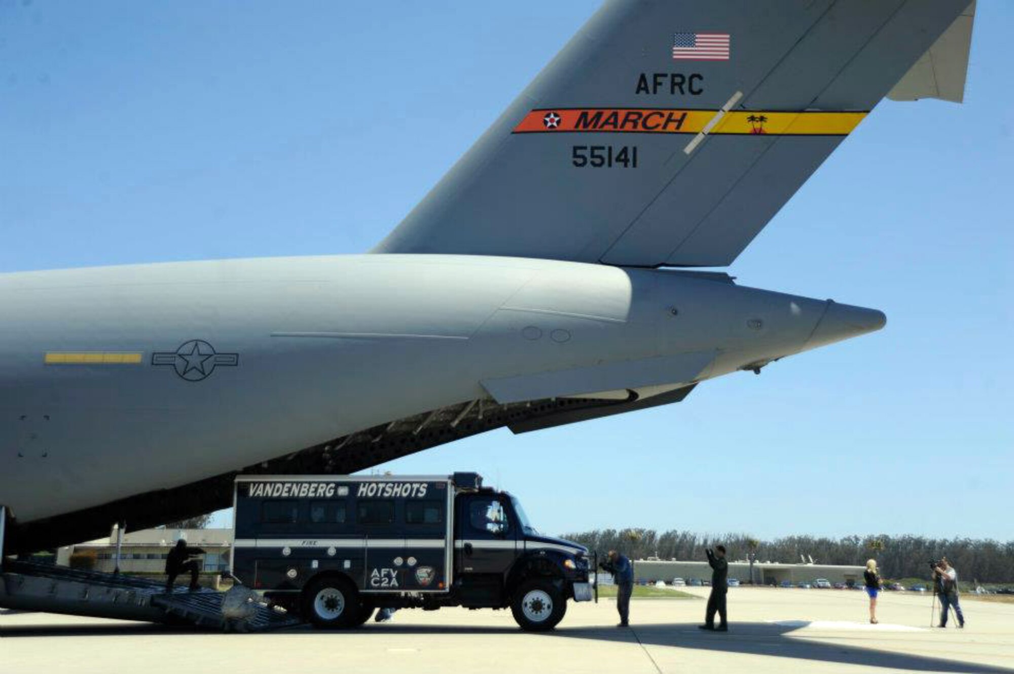 A Vandenberg Air Force Base Hot Shots vehicle backs into the belly of a March Air  Reserve Base, Calif., C-17 Globemaster III at Vandenberg AFB, Calif., on June 27, 2012. Eighteen members of the Vandenberg Hot Shots crew, along with two crew carrier vehicles, one superintendent support vehicle and one all terrain vehicle, deployed to Colorado to support the wild land fire-fighting efforts. (U.S. Air Force photo by Staff Sgt. Andrew Satran)