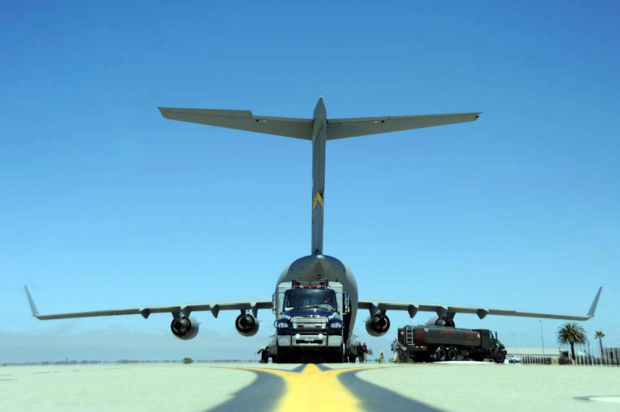 A Vandenberg Air Force Base Hot Shots vehicle backs into the belly of a March Air  Reserve Base, Calif., C-17 Globemaster III at Vandenberg AFB, Calif., on June 27, 2012. Eighteen members of the Vandenberg Hot Shots crew, along with two crew carrier vehicles, one superintendent support vehicle and one all terrain vehicle, deployed to Colorado to support the wild land fire-fighting efforts. (U.S. Air Force photo by Staff Sgt. Andrew Satran)