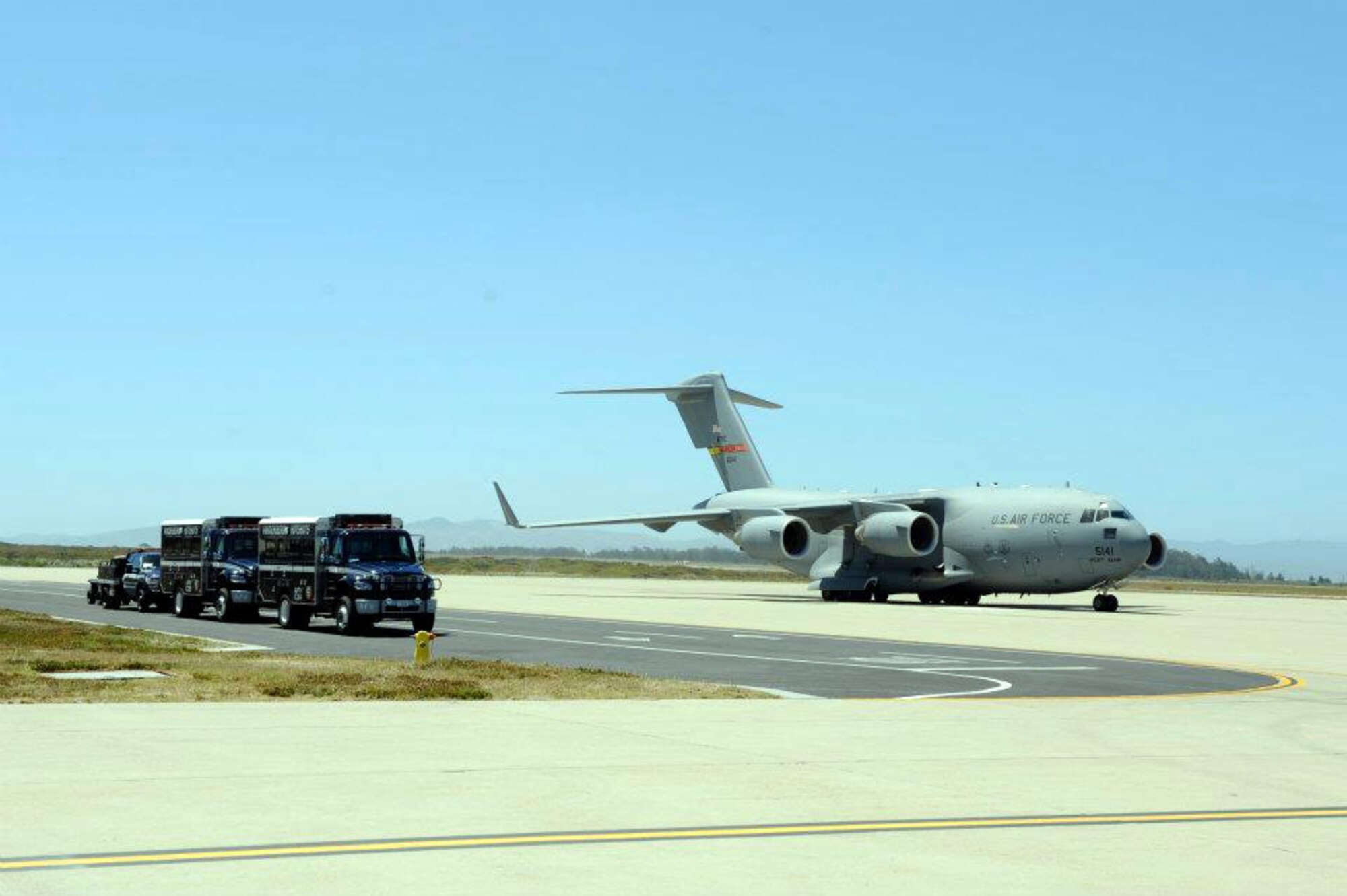 A Vandenberg Air Force Base Hot Shots vehicle backs into the belly of a March Air  Reserve Base, Calif., C-17 Globemaster III at Vandenberg AFB, Calif., on June 27, 2012. Eighteen members of the Vandenberg Hot Shots crew, along with two crew carrier vehicles, one superintendent support vehicle and one all terrain vehicle, deployed to Colorado to support the wild land fire-fighting efforts. (U.S. Air Force photo by Staff Sgt. Andrew Satran)