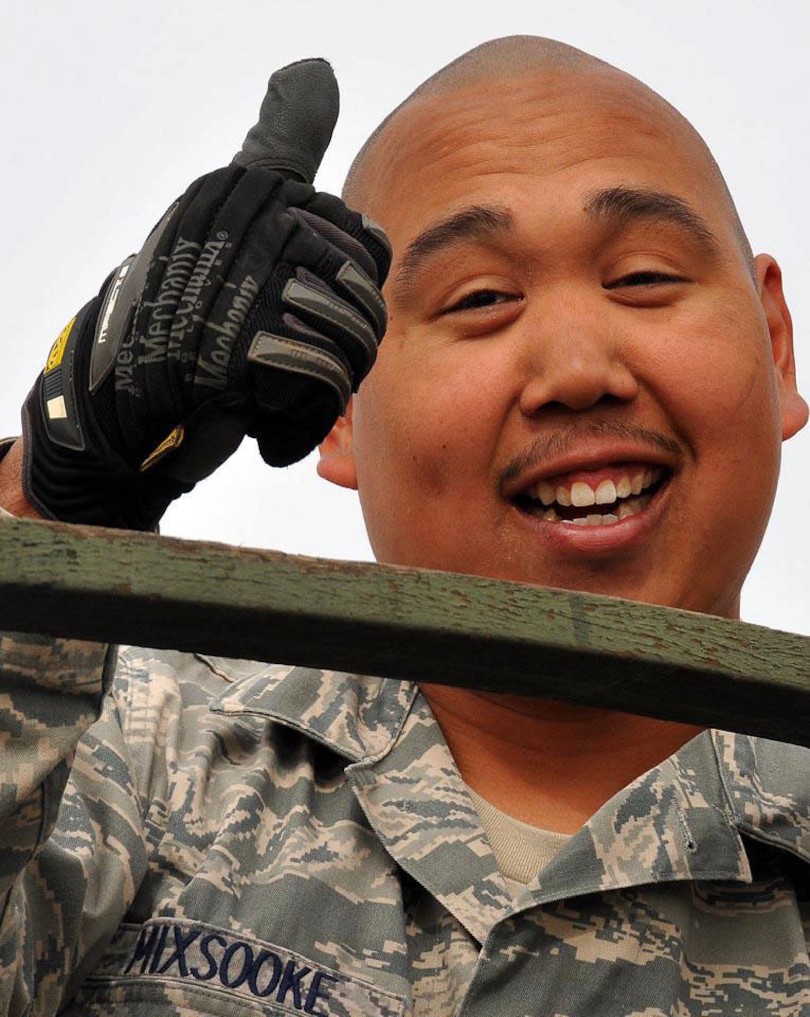 COAST GURAD AIR STATION BORINQUEN, Puerto Rico -- Senior Airman Cameron Mixsooke gives the 'thumbs-up' Feb. 26, 2010, during a Deployment For Training here with the 176 Civil Engineer Squadron. Mixsooke kept us skills fresh to be ready when called upon. National Guard photo by Capt. John Callahan.