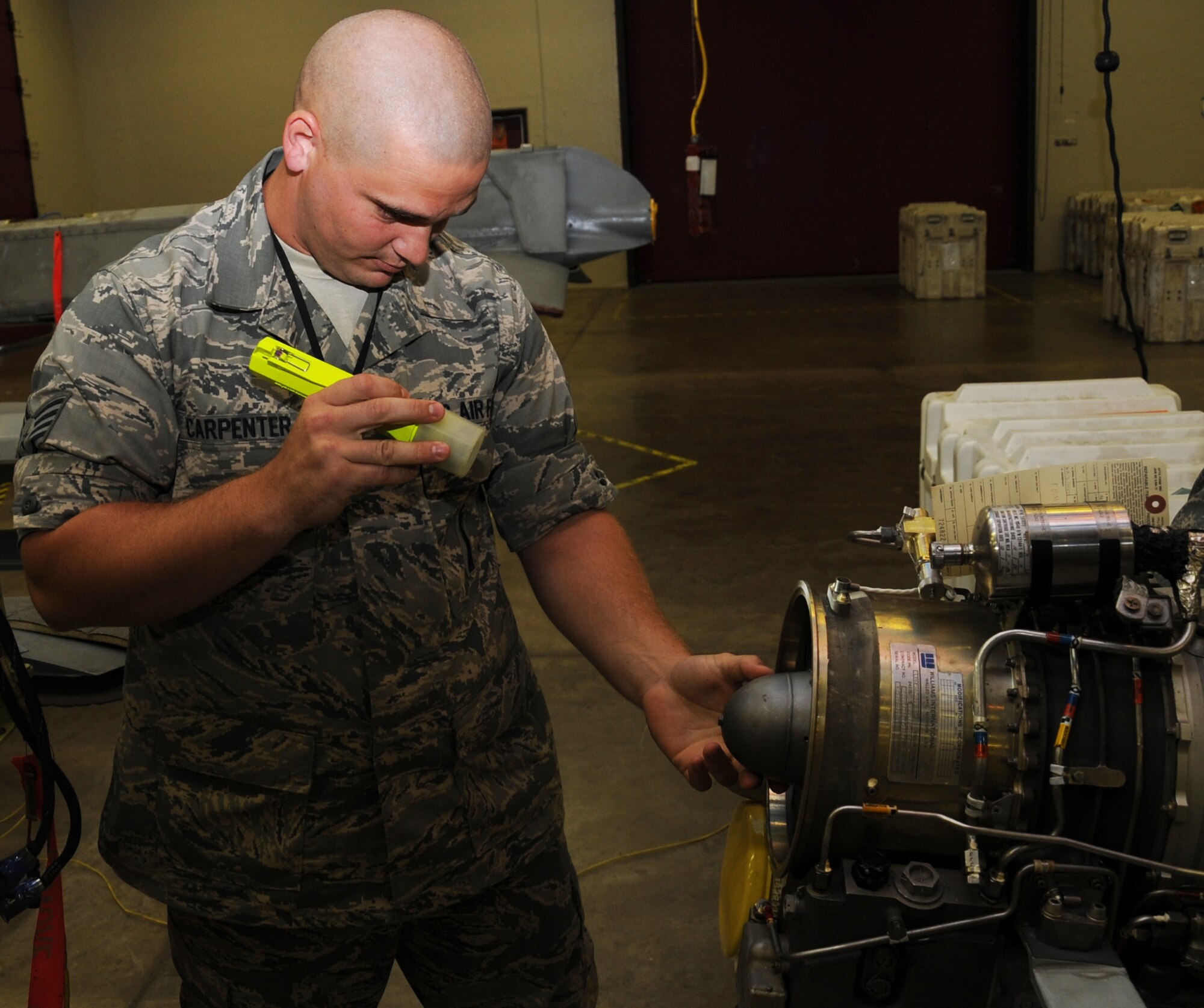 Staff Sgt. Keith Carpenter, 2nd Munitions Squadron cruise missile flight instructor, performs a turbo fan engine visual inspection on an Air to Ground Missile-86C on Barksdale Air Force Base, La., July 2. This inspection is accomplished prior to installation into the missile to check for defects that would degrade performance in the event of an operational launch. (U.S. Air Force photo/Senior Airman Sean Martin)(Released)