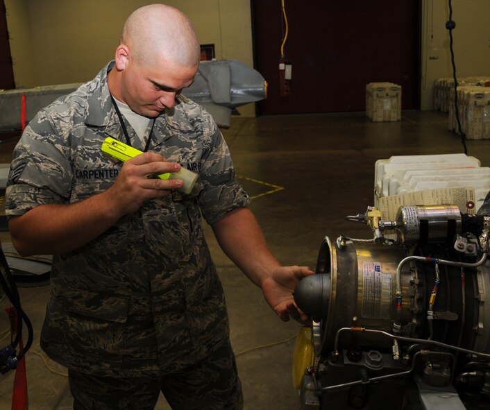 Staff Sgt. Keith Carpenter, 2nd Munitions Squadron cruise missile flight instructor, performs a turbo fan engine visual inspection on an Air to Ground Missile-86C on Barksdale Air Force Base, La., July 2. This inspection is accomplished prior to installation into the missile to check for defects that would degrade performance in the event of an operational launch. (U.S. Air Force photo/Senior Airman Sean Martin)(Released)