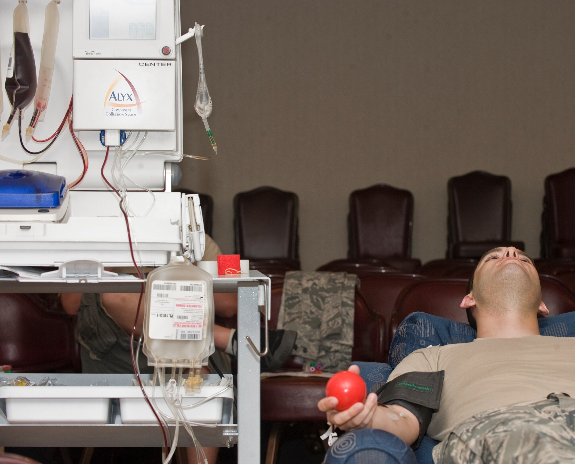 Airman 1st Class Johnny Guy, 7th Communication Squadron, waits 21 minutes while his blood is drawn during an on-base blood drive July 11, 2012, at Dyess Air Force Base, Texas. Each day blood donors serve as a lifeline to cancer patients, newborn babies, surgical patients, accident or trauma victims, dialysis patients and those with chronic anemia or blood disorders. For more information on donating blood, call (325) 670-2798 or logon to their Web site at www.meekbloodcenter.org. (U.S. Air Force photo by Airman 1st Class Jonathan Stefanko/ Released)