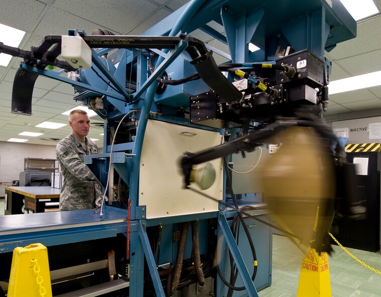 Senior Airman David Hammett, 2nd Maintenance Squadron Avionics Flight, tests an antenna from a B-52H Stratofortress on Barksdale Air Force Base, La., July 10. During the test, the antenna rotated just as it would inside the nose of a B-52 to replicate actual working conditions. (U.S. Air Force photo/Staff Sgt. Chad Warren)(RELEASED)