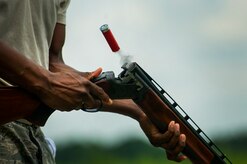 Senior Airman William George, 628th Communications Squadron knowledge operations management journeyman, reloads his shotgun during a skeet and trap shoot at Joint Base Charleston - Air Base, S.C., July 11, 2012. The Airmen participated in a skeet and trap shoot sponsored by the Single Airman Initiative Program, which aims to build camaraderie among Airmen and leadership while increasing communication and understanding. (U.S. Air Force photo by Airman 1st Class George Goslin/Released)