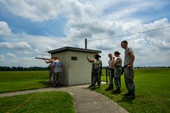 Airmen wait in rotation to fire during a skeet and trap shoot at Joint Base Charleston - Air Base, S.C., July 11, 2012. The Airmen participated in a skeet and trap shoot sponsored by the Single Airman Initiative Program, which aims to build camaraderie among Airmen and leadership while increasing communication and understanding. (U.S. Air Force photo by Airman 1st Class George Goslin/Released)
