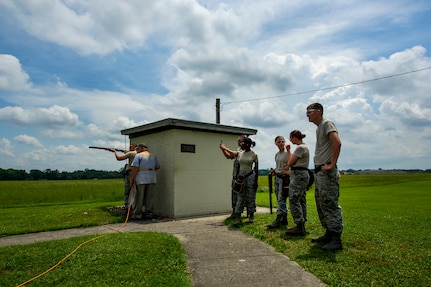 Airmen wait in rotation to fire during a skeet and trap shoot at Joint Base Charleston - Air Base, S.C., July 11, 2012. The Airmen participated in a skeet and trap shoot sponsored by the Single Airman Initiative Program, which aims to build camaraderie among Airmen and leadership while increasing communication and understanding. (U.S. Air Force photo by Airman 1st Class George Goslin/Released)