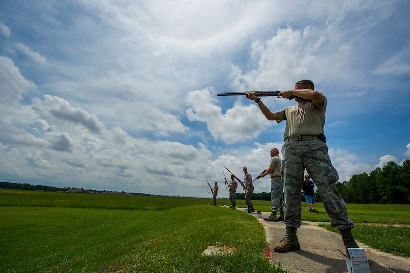 Lt. Col. David Schlevensky, 628th Medical Support Squadron commander, fires his shotgun during a skeet and trap shoot at Joint Base Charleston - Air Base, S.C., July 11, 2012. The Airmen participated in a skeet and trap shoot sponsored by the Single Airman Initiative Program, which aims to build camaraderie among Airmen and leadership while increasing communication and understanding. (U.S. Air Force photo by Airman 1st Class George Goslin/Released)