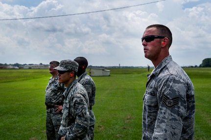 Staff Sgt. Ryan Montoya, 628th Civil Engineer Squadron structural craftsman, watches an Airman fire at clay pigeons during a skeet and trap shoot at Joint Base Charleston - Air Base, S.C., July 11, 2012. The Airmen participated in a skeet and trap shoot sponsored by the Single Airman Initiative Program, which aims to build camaraderie among Airmen and leadership while increasing communication and understanding. (U.S. Air Force photo by Airman 1st Class George Goslin/Released)