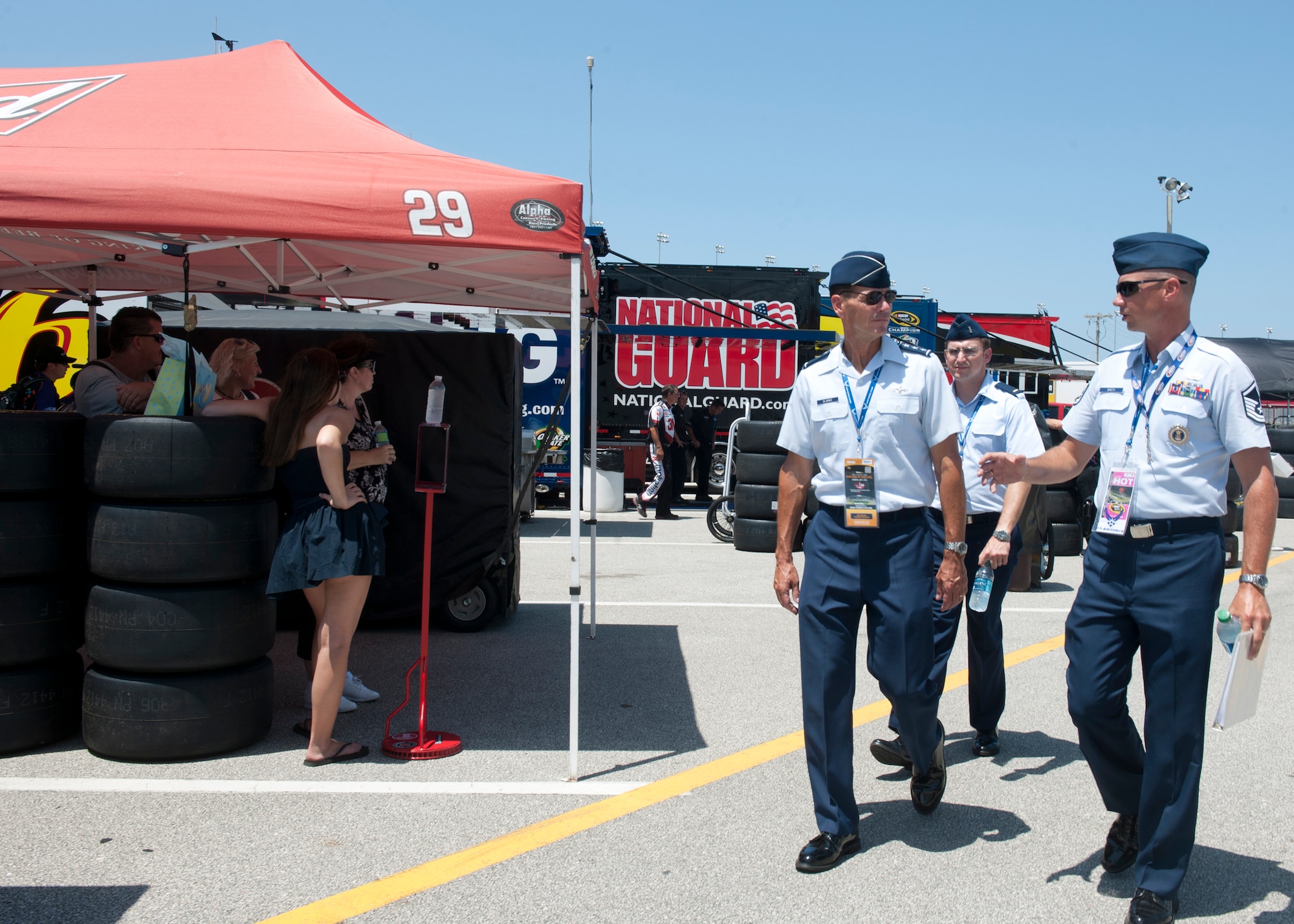 U.S. Air Force Lt. Gen. Stanley Clarke, Continental U.S. North American Aerospace Defense Command Region – 1st Air Force (Air Forces Northern) commander is escorted by Master Sgt. Brad Barth, 336th Recruiting Squadron marketing NCO, at the Daytona International Speedway July 7,2012, at Daytona Beach, Fla. Clarke visited the event to administer the Oath of Enlistment to future Airmen in the delayed entry program. (U.S. Air Force photo by Senior Airman Eileen Meier/Released)