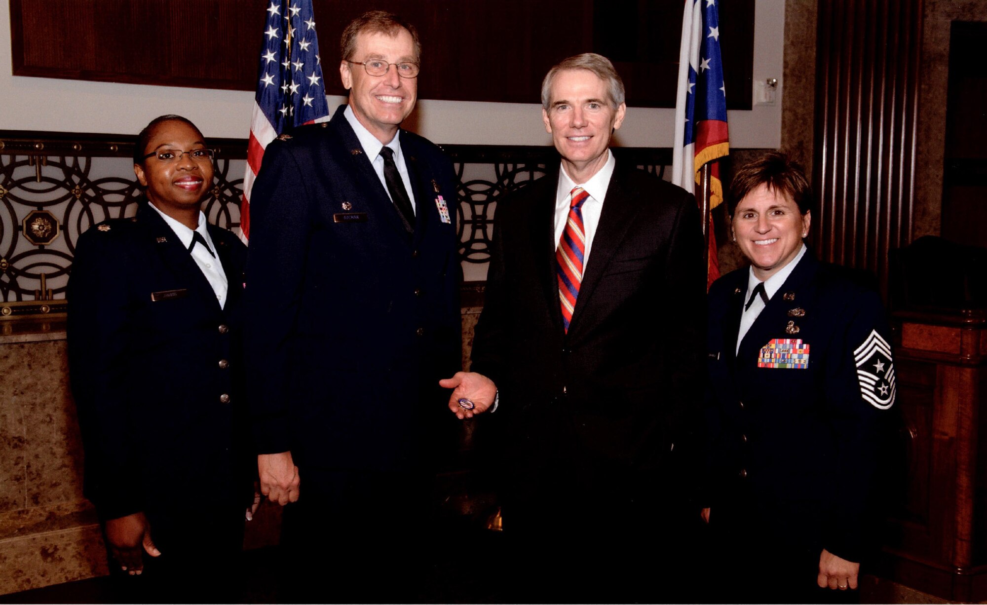 WRIGHT-PATTERSON AIR FORCE BASE, Ohio – Col. Stephen D. Goeman, 445th Airlift Wing commander, Chief Master Sgt. Peri Rogowski, 445th Airlift Wing command chief and Lt. Col. Cynthia Harris, 445th Airlift Wing Chief of Public Affairs visit with the honorable Rob Portman, United States Senator for Ohio, during a visit to the Capitol June 19 and 20. Commanders meet annually with Congressmen representing their areas as part of an Air Force Reserve program to increase their unit’s visibility with members of Congress. (Courtesy photo)