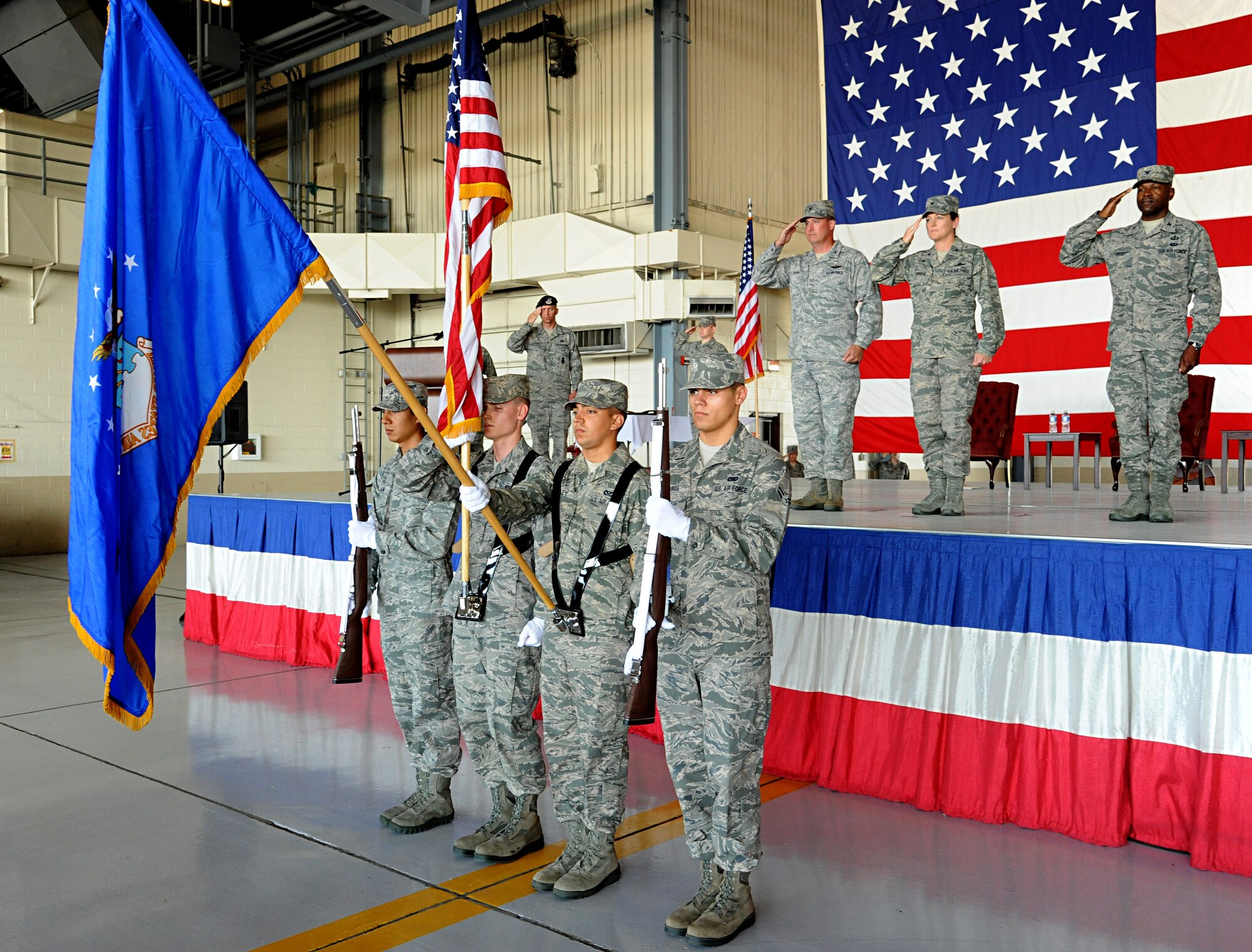 Members of the 319th Air Base Wing Honor Guard present the colors during the 319th Mission Support Group change of command ceremony, Grand Forks Air Force Base, N.D., July 10, 2012.  Col. Joe Lindsey assumed command of the 319th MSG from Col. Tammy Knierim.  (U.S. Air Force photo by Senior Airman Amber Bennett)