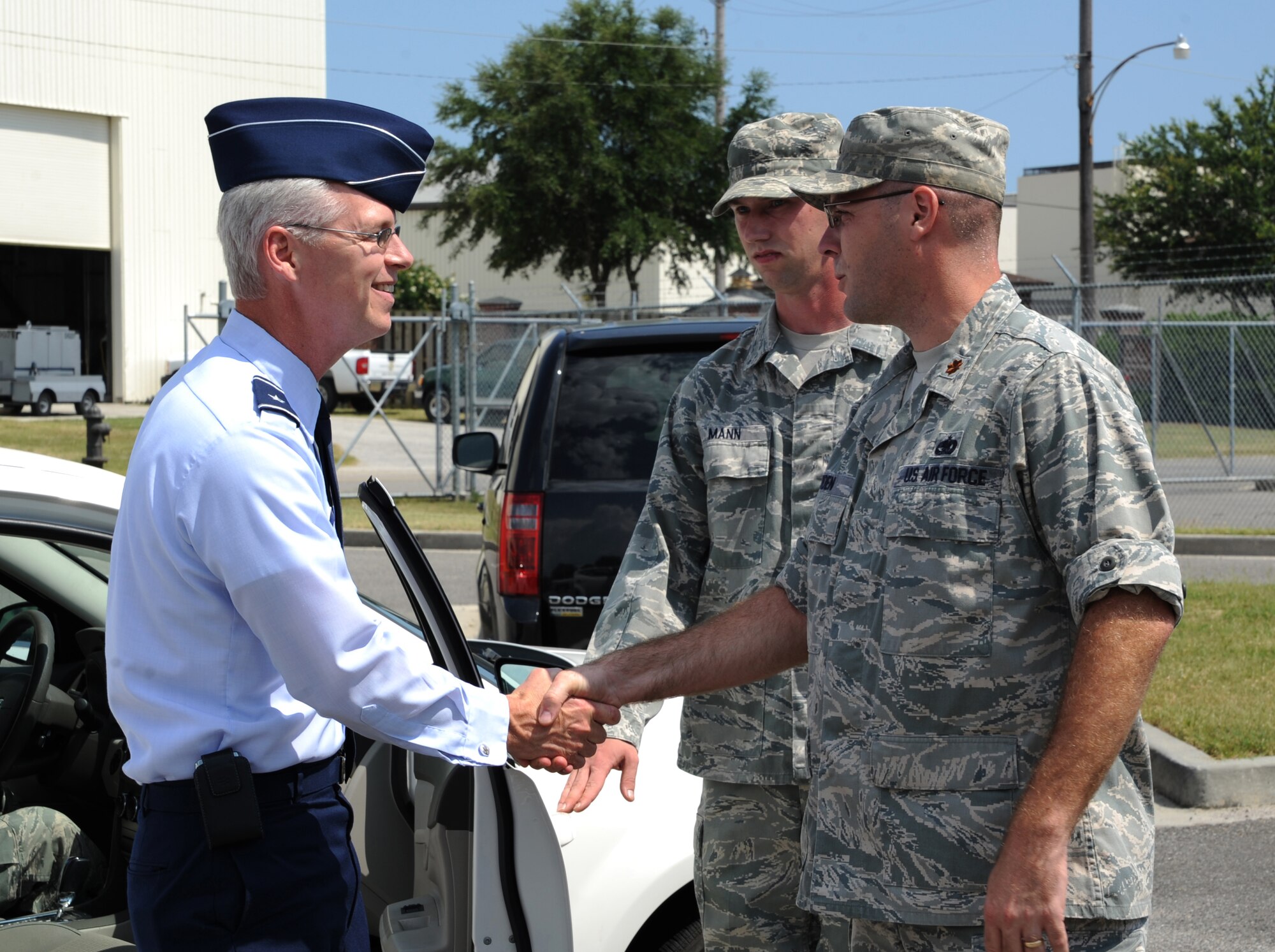 Brig. Gen. Les Kodlick, Director of Public Affairs, Office of the Secretary of the Air Force, the Pentagon, Washington D.C., is greeted by Maj. Jason Bowden, 628th Logistics Readiness Squadron operations officer, during his visit to Joint Base Charleston July 10, 2012. Kodlick received a briefing on 628th LRS Port Opertaions after attending the 1st Combat Camera Squadron change of command earlier that day. Kodlick is responsible for developing and executing global communication processes to build understanding and support for the Air Force. (U.S. Air Force photo/Airman 1st Class Ashlee Galloway)

