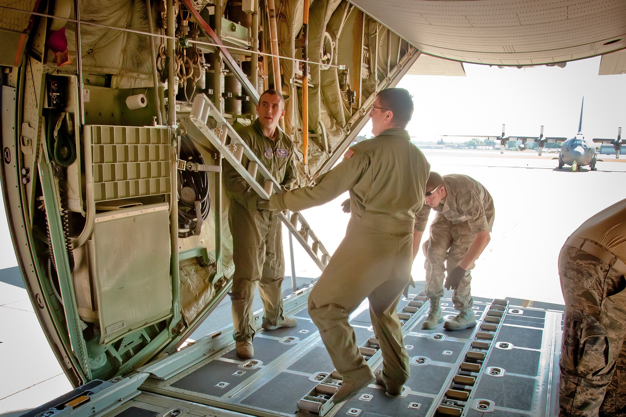 The 27th Aerial Port Squadron conducts a cargo deployment exercise on July 7.  The exercise maintains unit readiness and allows Airmen practice loading and securing many types of equipment.  (U.S. Air Force Photo/Shannon McKay)