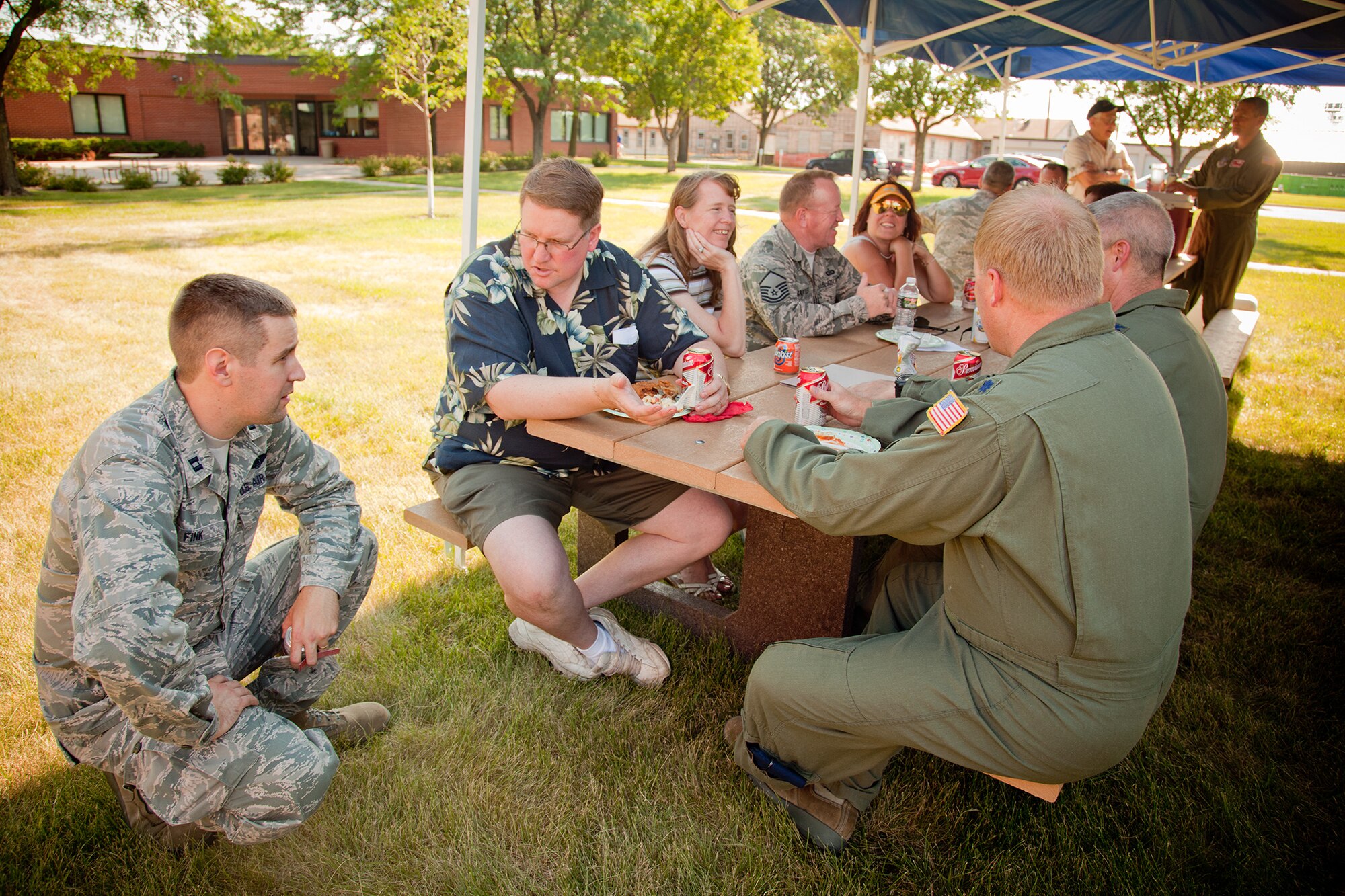 Honorary commander David Downing talks with Capt. David Fink at the 934th Airlift Wing's first Honorary Commanders and Base Community Council picnic July 7.  The HC and BCC programs help strengthen community partnerships with the 934 AW, Minneapolis-St. Paul Air Reserve Station, Minn.  (U.S. Air Force Photo/Shannon McKay)