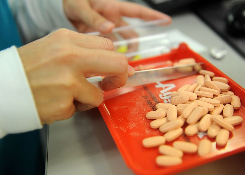 Desiree Wolfe, 23d Medical Support Squadron pharmacy technician, fills a prescription at Moody Air Force Base, Ga., July 11, 2012. On average, the pharmacy fills 12,500 prescriptions per month. (U.S Air Force photo by Staff Sgt. Ciara Wymbs/Released) 