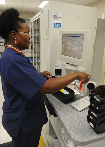 Zina Smith, 23d Medical Support Squadron pharmacy technician, scans the barcode on a prescription at Moody Air Force Base, Ga., July 11, 2012. The pharmacy services beneficiaries in Georgia and Florida. (U.S. Air Force photo by Staff Sgt. Ciara Wymbs/Released) 