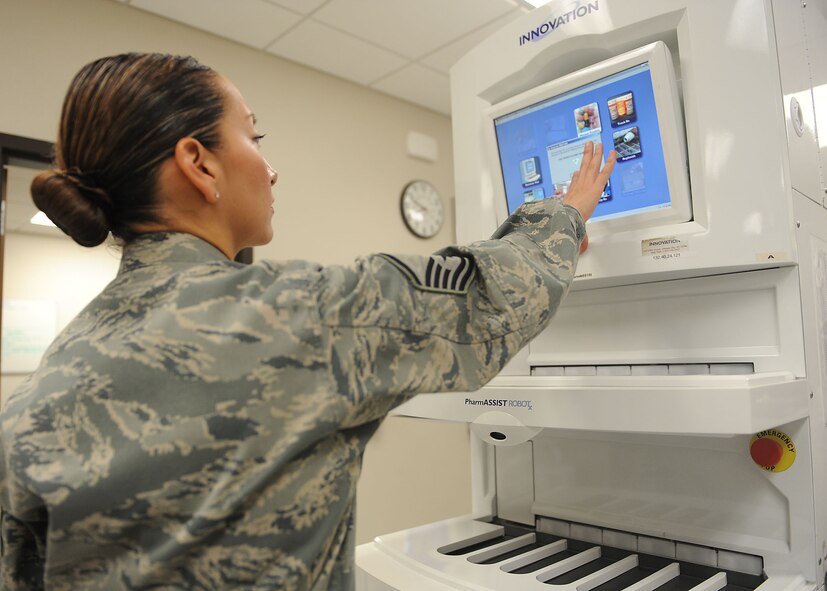 U.S. Air Force Master Sgt. Abigail Esparza, 23d Medical Support Squadron pharmacy technician, logs into the automated fill machine at Moody Air Force Base, Ga., July 11, 2012. The pharmacy has three automated refills machines worth $412,000 and also has the largest budget in the 23d Medical Group. (U.S Air Force photo by Staff Sgt. Ciara Wymbs/Released)  
