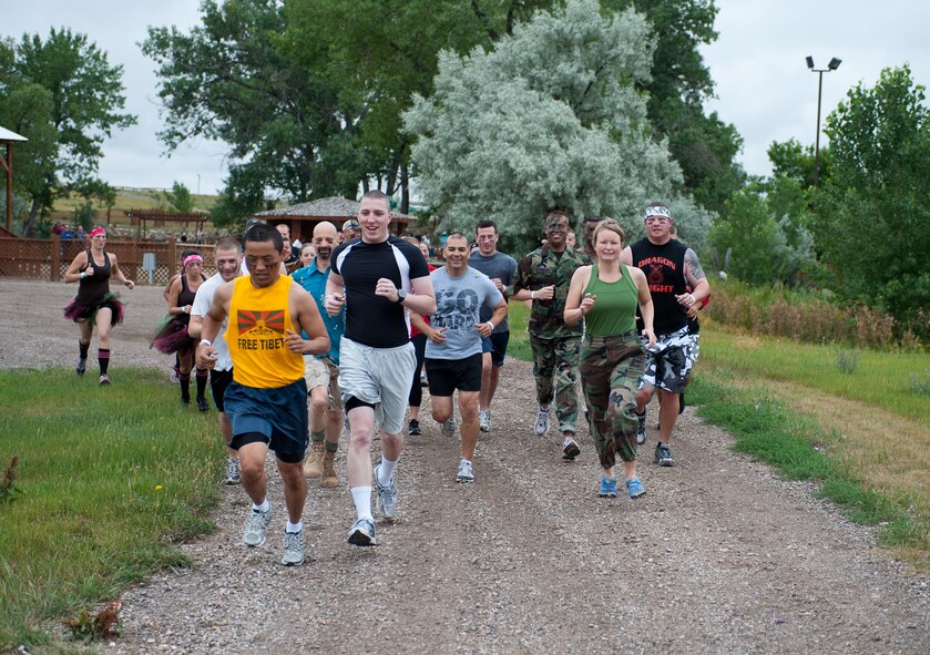 Competitors begin the first leg of the Commando Challenge 5k obstacle course at the Buffalo Chip Campground near Sturgis, S.D., July 7, 2012. The 28th Force Support Squadron Airman and Family Readiness Center at Ellsworth Air Force Base, S.D. hosted the event open to all military members and their families that focused on the four pillars of wellness. (U.S. Air Force photo by Airman 1st Class Alystria Maurer/Released)