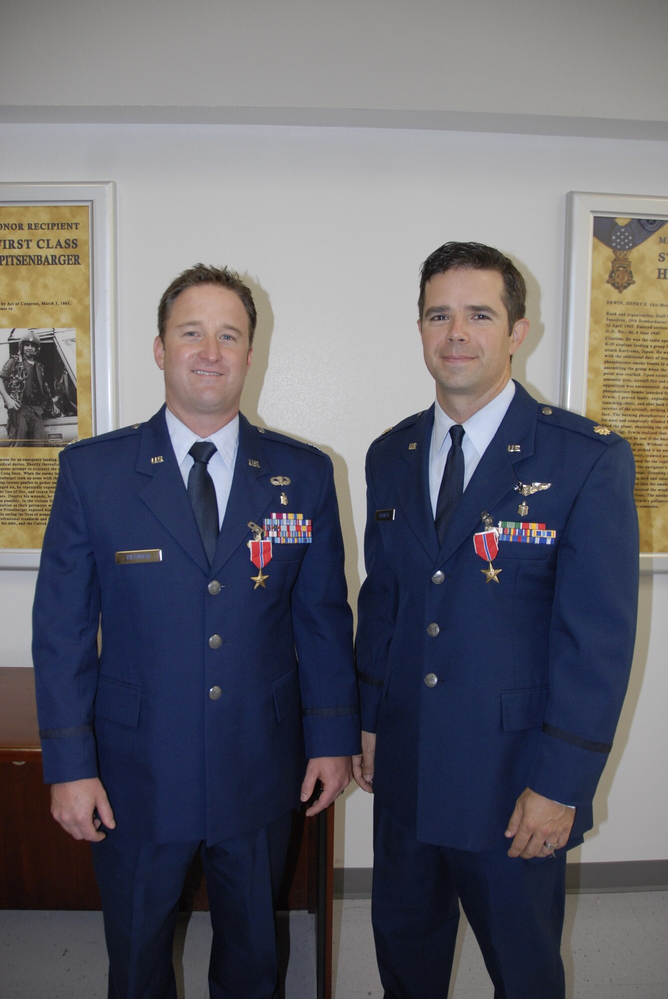 Lt Col. Patrick Brannan (left) and Maj. Richard Barnett, surgeons with the 96th Medical Group's Surgical Support Squadron, were awarded the Bronze Star July 11 at Eglin Air Force Base, Fla.  Brannan was honored for meritorious service while deployed in support of Operation Enduring Freedom, Combined Joint Special Operations Task Force, Afghanistan.  He successfully completed 604 life saving operations on United States and local patients.  Barnett was honored for meritorious service while deployed in support of Operation
Enduring Freedom, 455th Expeditionary Medical Operations Squadron, Task Force Medical, Afghanistan.  He provided more than 4,200 hours of uninterrupted calls over a 179-day tour, during which he performed more than 315 surgeries.  (U.S. Air Force photo/Kevin Gaddie)
