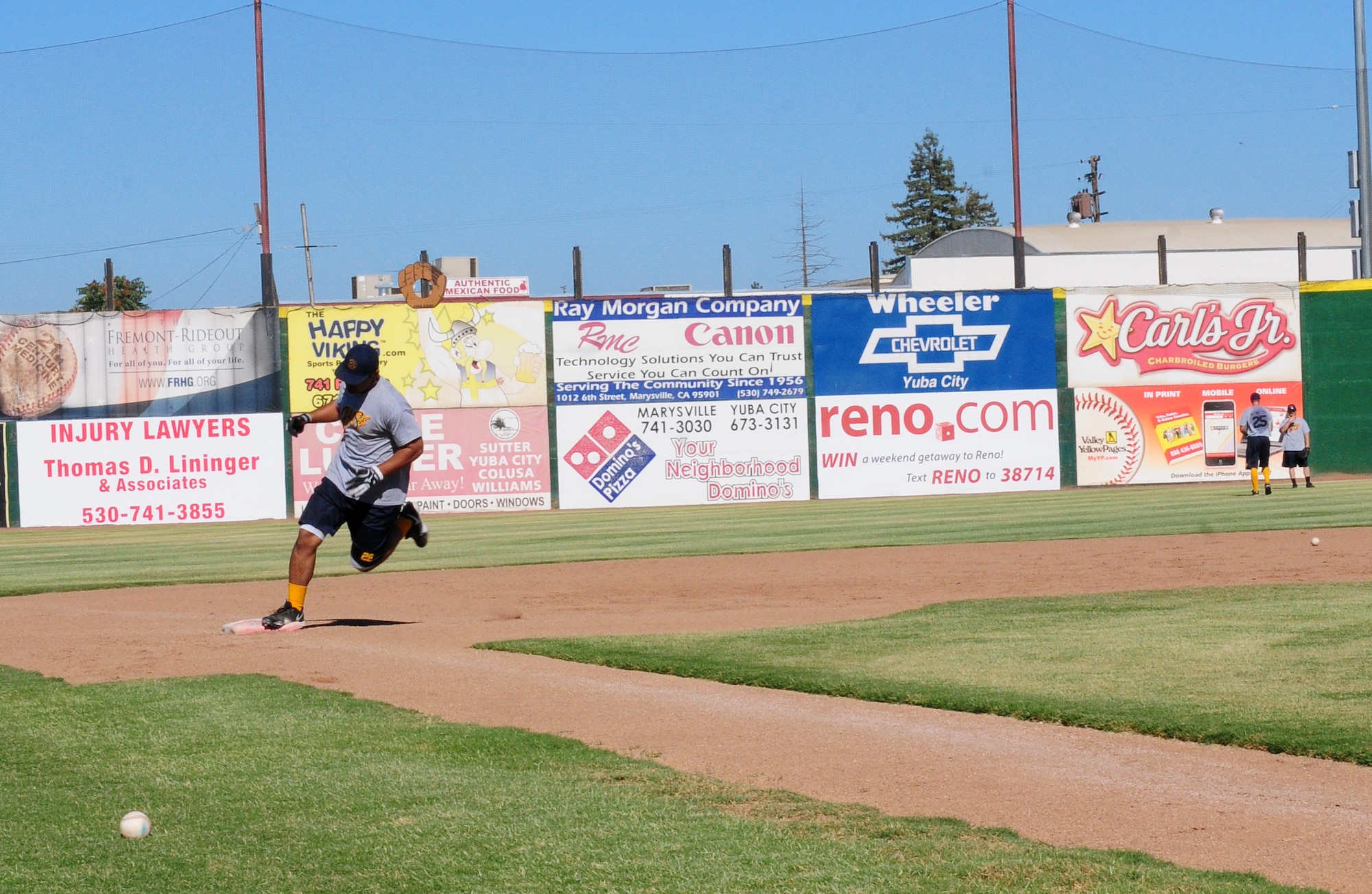 Air Force Academy Cadet Seth Kline rounds third base during pregame warm-ups at Appeal-Democrat Field in Marysville, Calif. July 5. The Goldsox are a summer league team consisting of college athletes from all over the nation coming to stay fresh on their skill during their schools offseason. (U.S. Air Force photo by Senior Airman Allen Pollard)