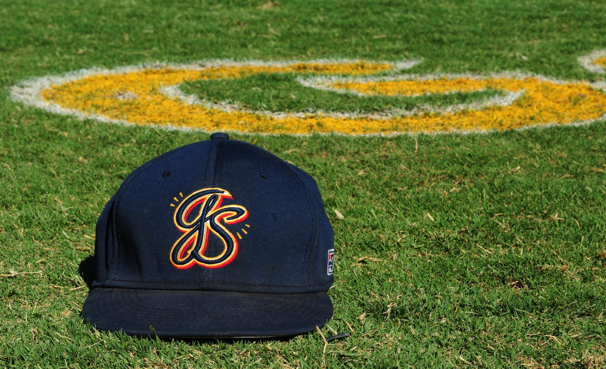 Marysville Goldsox hat sits on Appeal-Democrat Field during pregame warm-ups July 5 in Marysville, Calif. The Goldsox defeated the California Glory of Lodi, Calif. 8-3. (U.S. Air Force photo by Senior Airman Allen Pollard)