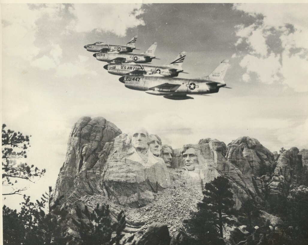 Four F-86D Sabre Dogs assigned to the 54th Fighter Interceptor Squadron at Ellsworth Air Force Base, S.D, are shown operating near Mount Rushmore, S.D. The Airmen in the 54th FIS maintained an around-the-clock alert plan designed to have pilots respond to unidentified aircraft within two minutes. (U.S. Air Force Courtesy Photo, Released)