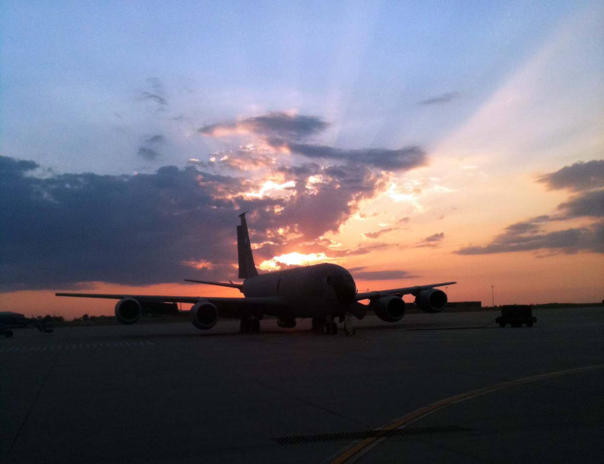 A KC-135 Stratotanker sits on the flight line as the sun sets at McConnell Air Force Base, Kan., July 10, 2012.  The KC-135 provides the core aerial refueling capability for the U.S. Air Force, and has been performing in this role for more than 50 years.  (U.S. Air Force photo by Lt. Col. Travis Clark) 