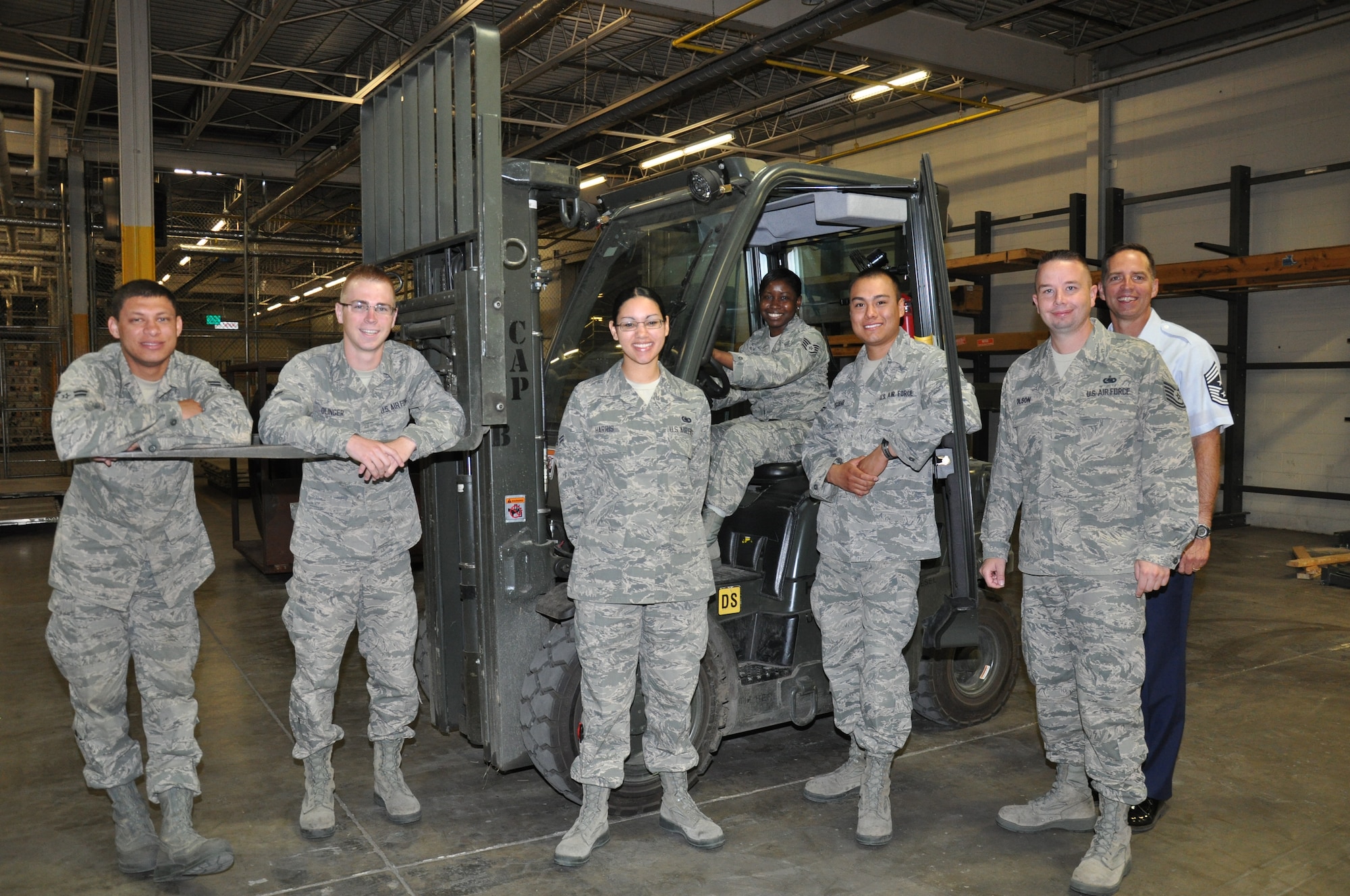 Within the 5th Logistics Readiness Squadron's Materiel Management Flight, the Maintenance Support Section consists of the Flight Service Center and Maintenance Supply Liaison elements.  Flight Service Center recovers and forwards all due-in-from maintenance (DIFM) assets to Air Force repair facilities, Defense Reutilization & Marketing Office (DRMO) or the Air Force Repair Enhancement Program (AFREP) office for on base repair.  Maintenance Supply Liaison manages the procurement and tracking of all non mission capable (MICAP) asset requirements for the 23rd and 69th Bomb Squadrons."

Names starting from the left:

A1C Bell, Amn Olinger, A1C Harris, SSgt Taggart, A1C Escobar, TSgt Olson and Chief--Not pictured TSgt Williams, SSgt Lindsey, SSgt Becker

