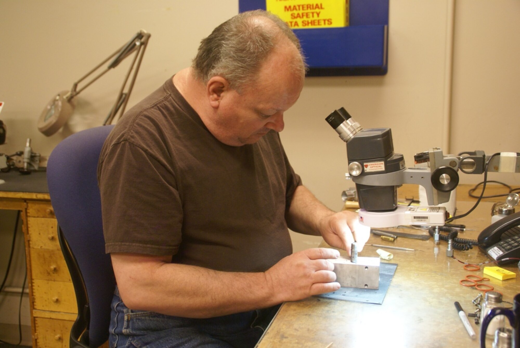 AEDC’s Randall Moon repairs a leaking water-cooled driveshaft for an emissivity sensor in the Aerothermodynamic Measurement Laboratory where he works. (Photo by Philip Lorenz III)