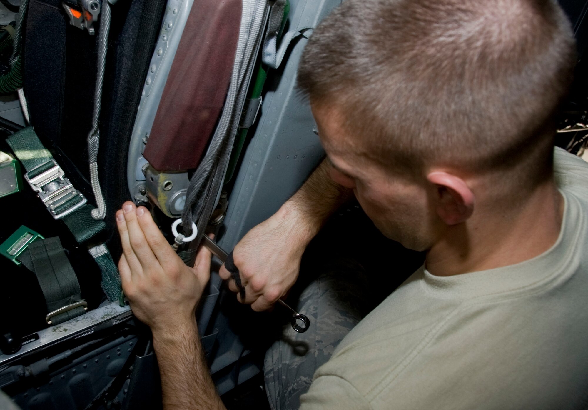 Senior Airman Brandon Craddock, 379th Expeditionary Maintenance Squadron aircrew egress systems journeyman, tightens down an emergency oxygen tank on a B-1 Lancer while deployed to Southwest Asia July 11, 2012. The four-man B-1 egress team maintains the ejection seats, hatches and crew ladder for the Lancer. (U.S. Air Force photo/Senior Airman Bryan Swink)