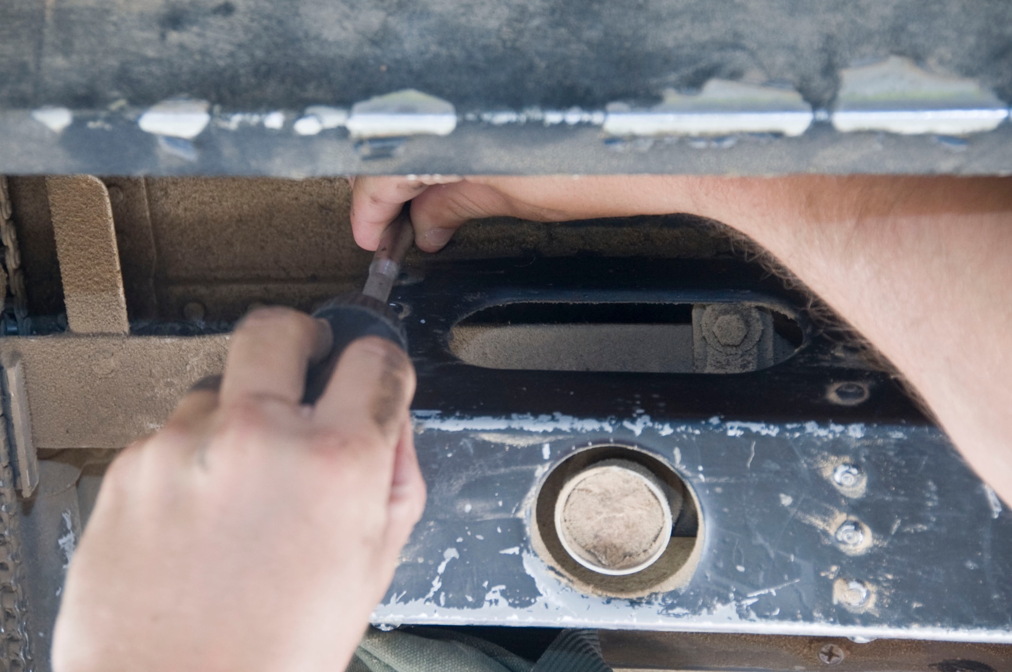 Senior Airman Kenneth Auchenbach’s hands stay steady as he completes maintenance on ballistic components for the B-1 Lancer’s crew ladder July 6, 2012. Auchenbach is an aircrew egress journeyman assigned to the 379th Expeditionary Maintenance Squadron in Southwest Asia. This four-man egress team works around the clock replacing, repairing and maintaining the ejection seats, hatches and crew ladders for the B-1. (U.S. Air Force photo/Senior Airman Bryan Swink)