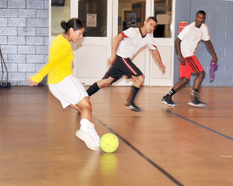 RAF MILDENHALL, England – Vanesa Rose, 100th Security Forces Squadron, winds up for a shot during an Intramural Indoor Soccer match against the 100th Civil Engineer Squadron at the North Side Fitness Center July 12, 2012. Intramural sports leagues are open to all squadrons on base as well as Department of Defense and Ministry of Defence employees. (U.S. Air Force photo/Senior Airman Jerilyn Quintanilla)  