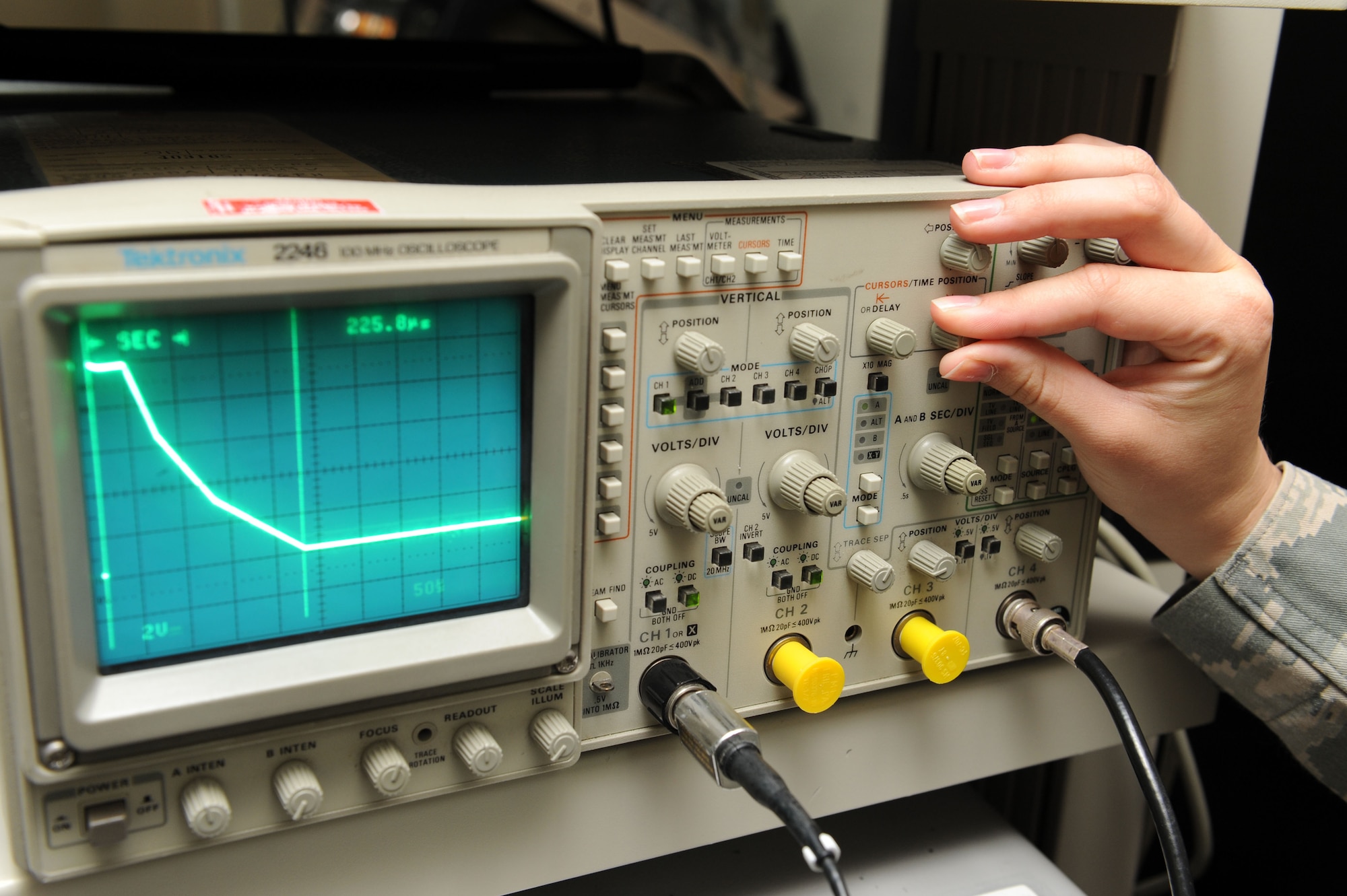 SPANGDAHLEM AIR BASE, Germany – Airman 1st Class Megan McMillan, 52nd Communications Squadron ground radar systems technician, checks the sensitivity time control on an indicator at the ground radar maintenance shop here July 10. The correct STC makes all aircraft appear the same size on the indicator ensuring the presentation is readable for air traffic controllers. Ground radar systems provide data used by air traffic controllers to manage Spangdahlem air space for U.S. and NATO aircraft. (U.S. Air Force photo by Senior Airman Christopher Toon/Released)