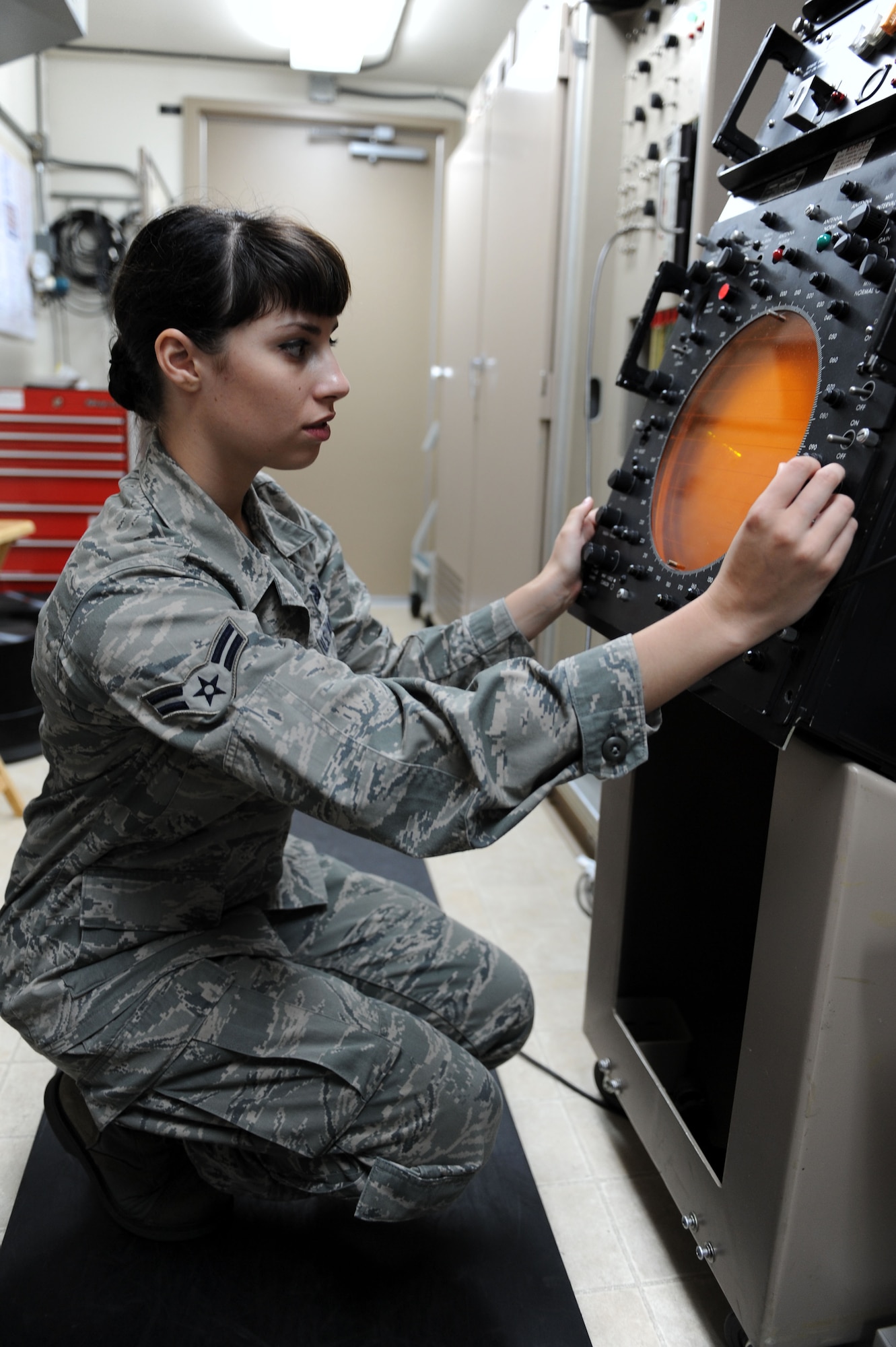 SPANGDAHLEM AIR BASE, Germany – Airman 1st Class Megan McMillan, 52nd Communications Squadron ground radar systems technician, verifies the radar air picture on a maintenance indicator at the ground radar maintenance shop here July 10. The radar air picture is the display the controllers use to monitor the weather and aircraft over Spangdahlem and the indicators are checked to ensure the accurateness of the visual quality for the air traffic controllers. Ground radar systems provide data used by air traffic controllers to manage Spangdahlem air space for U.S. and NATO aircraft. (U.S. Air Force photo by Senior Airman Christopher Toon/Released)