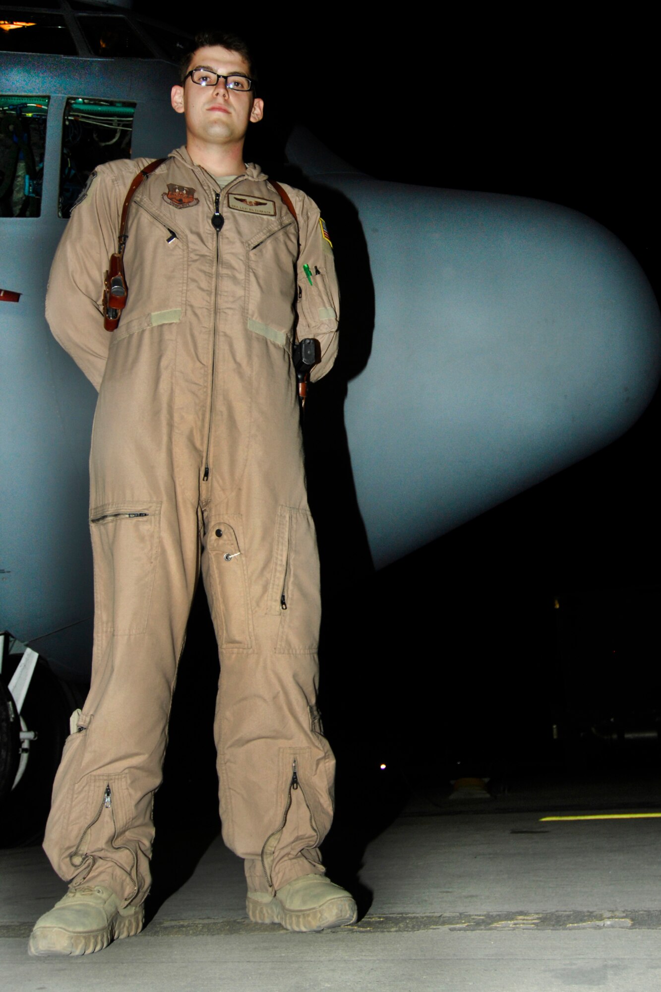 Senior Airman Levi Bilderback, 41st Expeditionary Electronic Combat Squadron EC-130H Compass Call analysis operator, pauses for a photo in front of an EC-130H after being presented with the Warrior of the Week award at Bagram Airfield, Afghanistan, July 10, 2012. Bilderback operates computer assisted information warfare equipment and performs emergency procedure actions as needed on the EC-130H. He has flown 15 combat missions and accumulated 79 hours in support of 24 International Security Assistance Force and Task Force Joint Tactical Air Support Requests. (U.S. Air Force photo/SSgt Jeff Nevison)