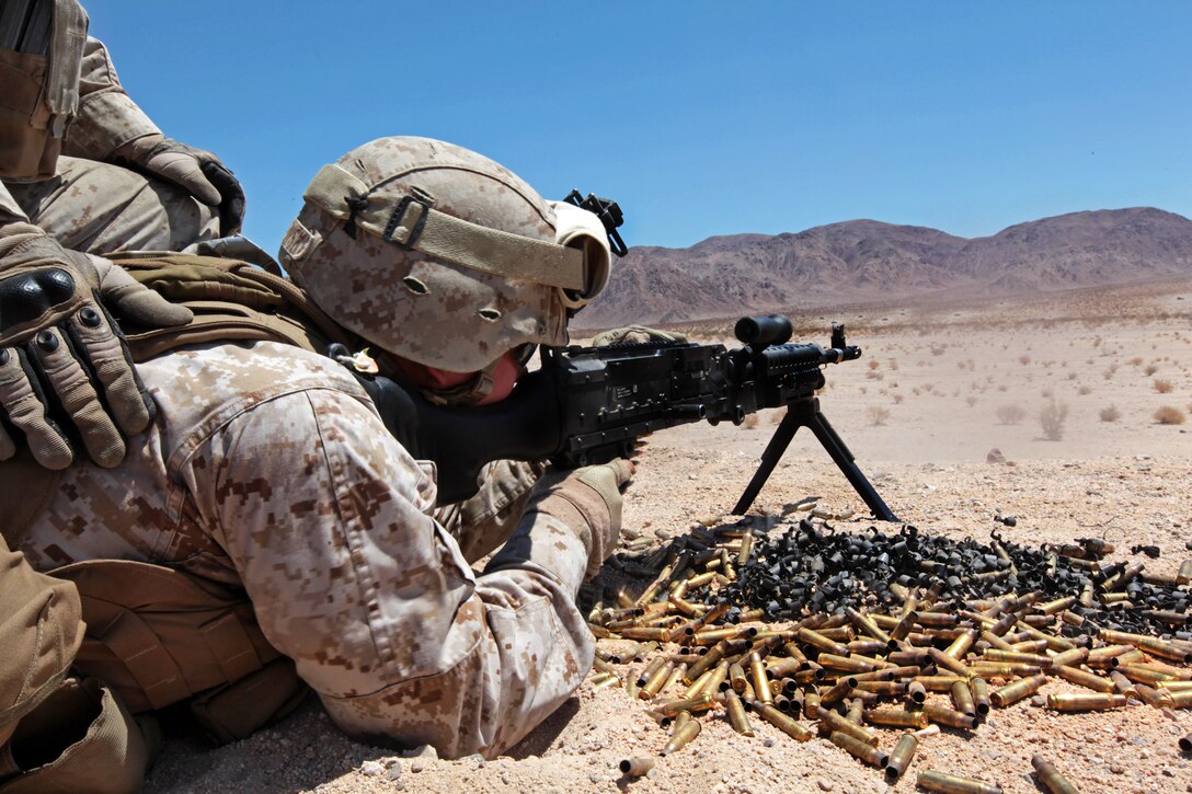 A Marine fires his M240G machine gun during a live-fire weapons training exercise as part of Javelin Thrust 2012 on Marine Corps Air Ground Combat Center Twentynine Palms, Calif., July 9, 2012. The Marine is assigned to the 1st Marine Expeditionary Brigade, Law Enforcement Battalion. Javelin Thrust is an annual exercise that allows active and reserve Marines and sailors from 38 different states to train together.