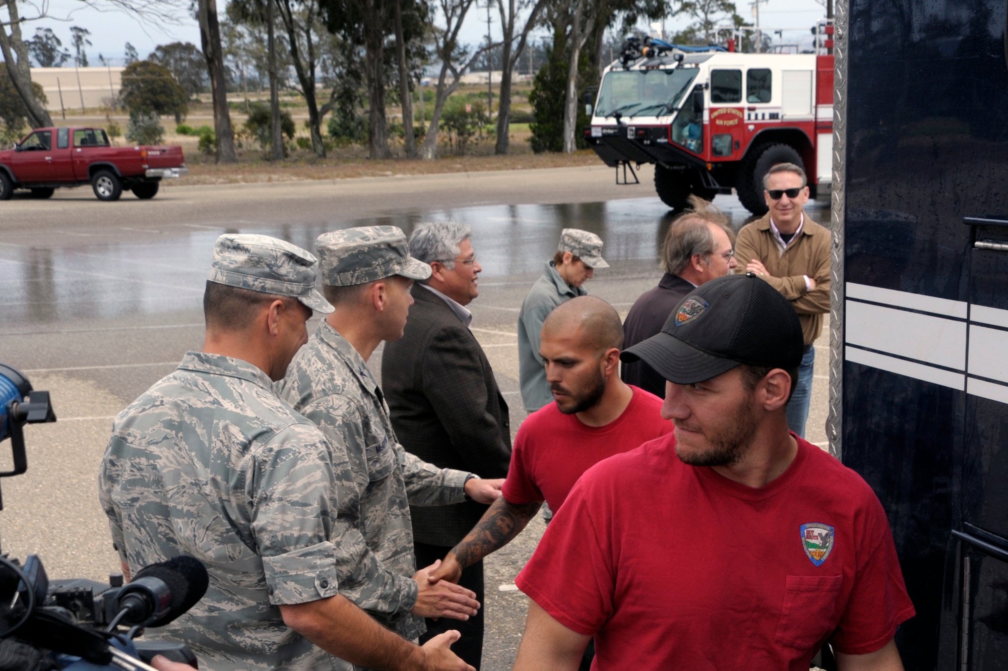VANDENBERG AIR FORCE BASE, Calif. -- Team Vandenberg members greet returning Vandenberg Hot Shots crew members here, Thursday, July 12, 2012. The Hot Shots were fighting wildfires in Colorado and Wyoming, which burned 29,168 acres total and destroyed nearly 350 houses in Colorado. (U.S. Air Force photo/Jerry E. Clemens Jr.) 